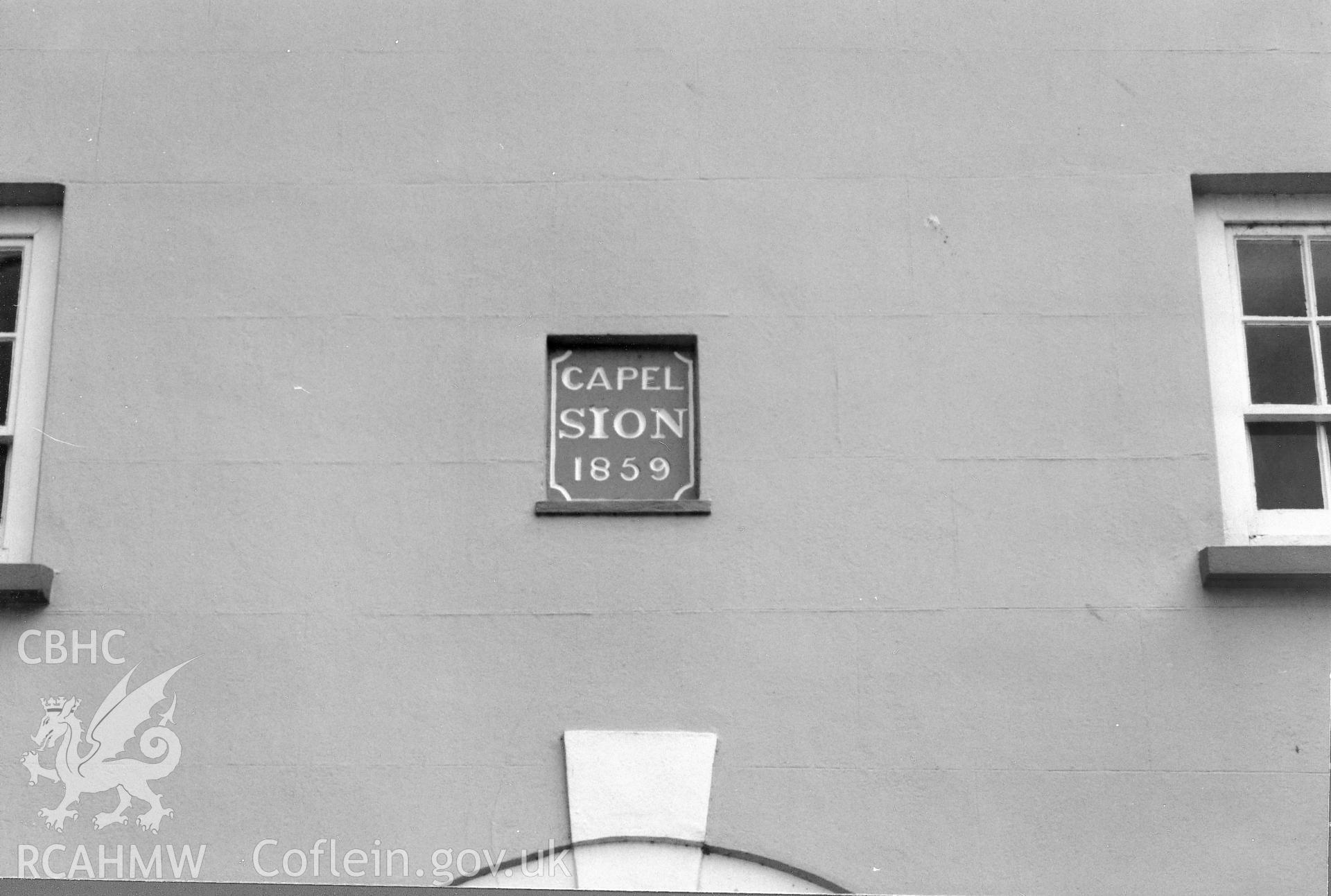 Digital copy of a black and white photograph showing a view of the datestone at Sion Welsh Baptist Chapel, Scleddau, taken by Robert Scourfield, 1996.