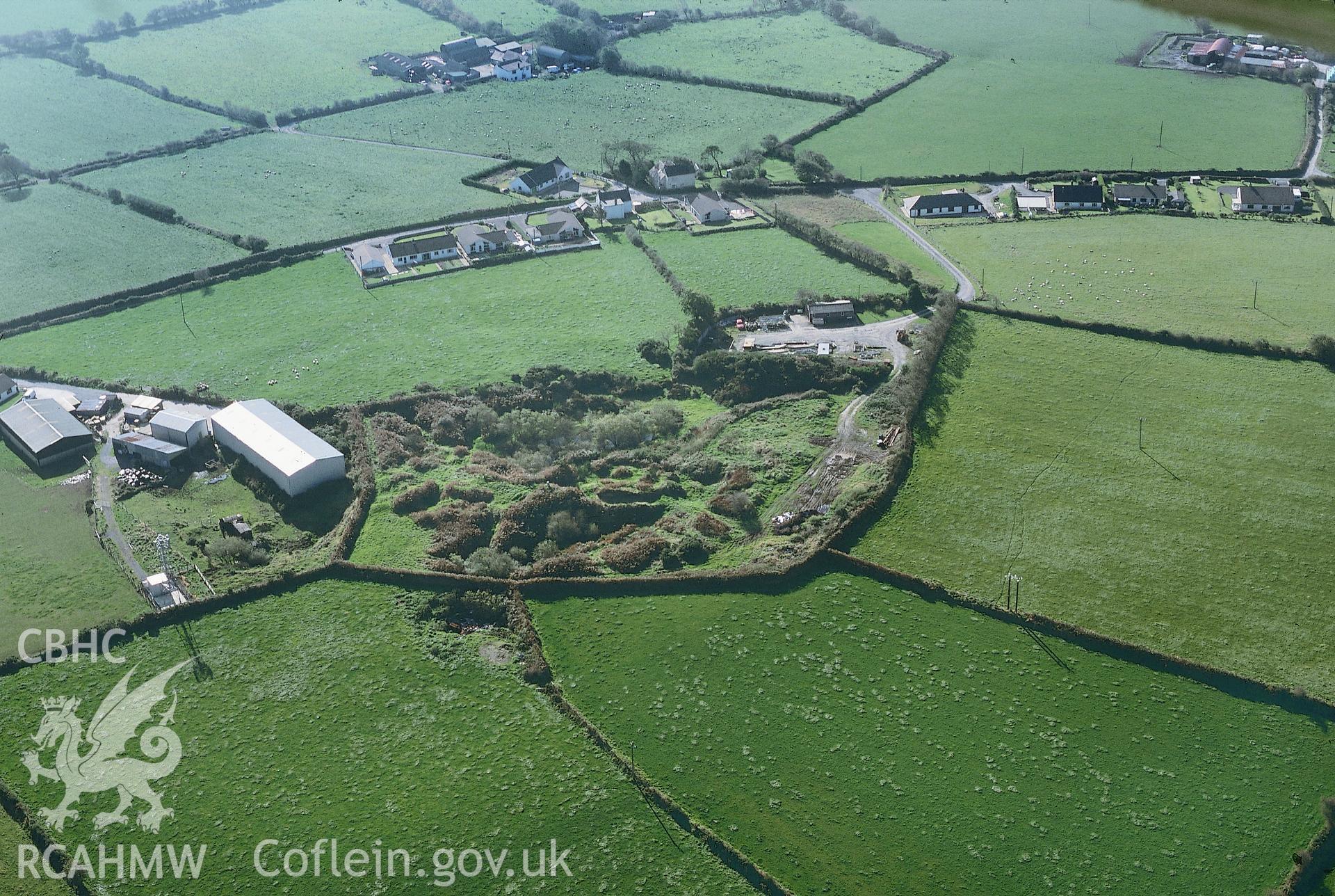 Slide of RCAHMW colour oblique aerial photograph showing Gaer Pwntan, Penybryn, taken by Toby Driver, 1999.