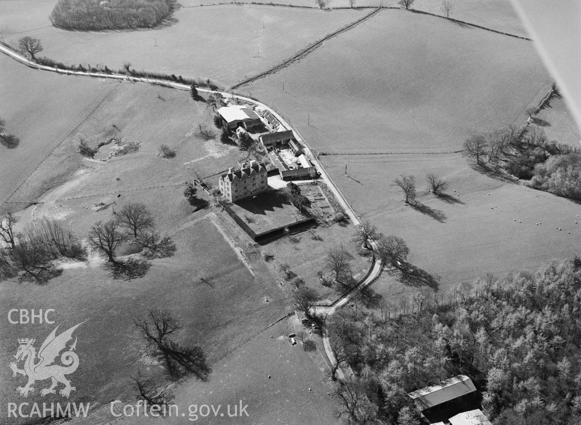 RCAHMW Black and white oblique aerial photograph of Treowen, Mitchel Troy, taken by C.R. Musson, 24/03/94