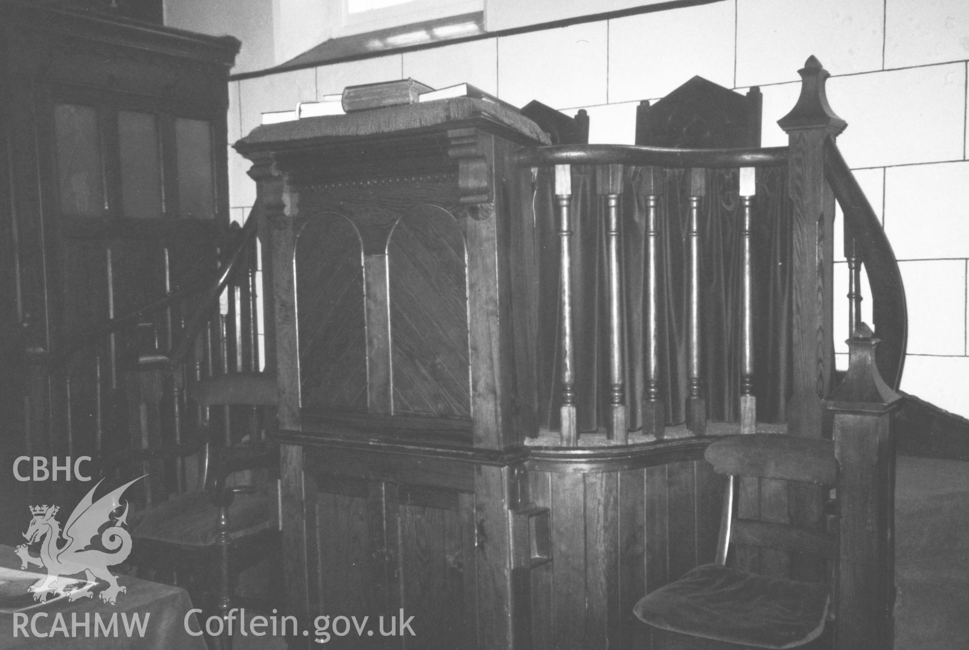 Digital copy of a black and white photograph showing an interior view of Bethania Chapel, Myddfai, taken by Robert Scourfield, 1996.