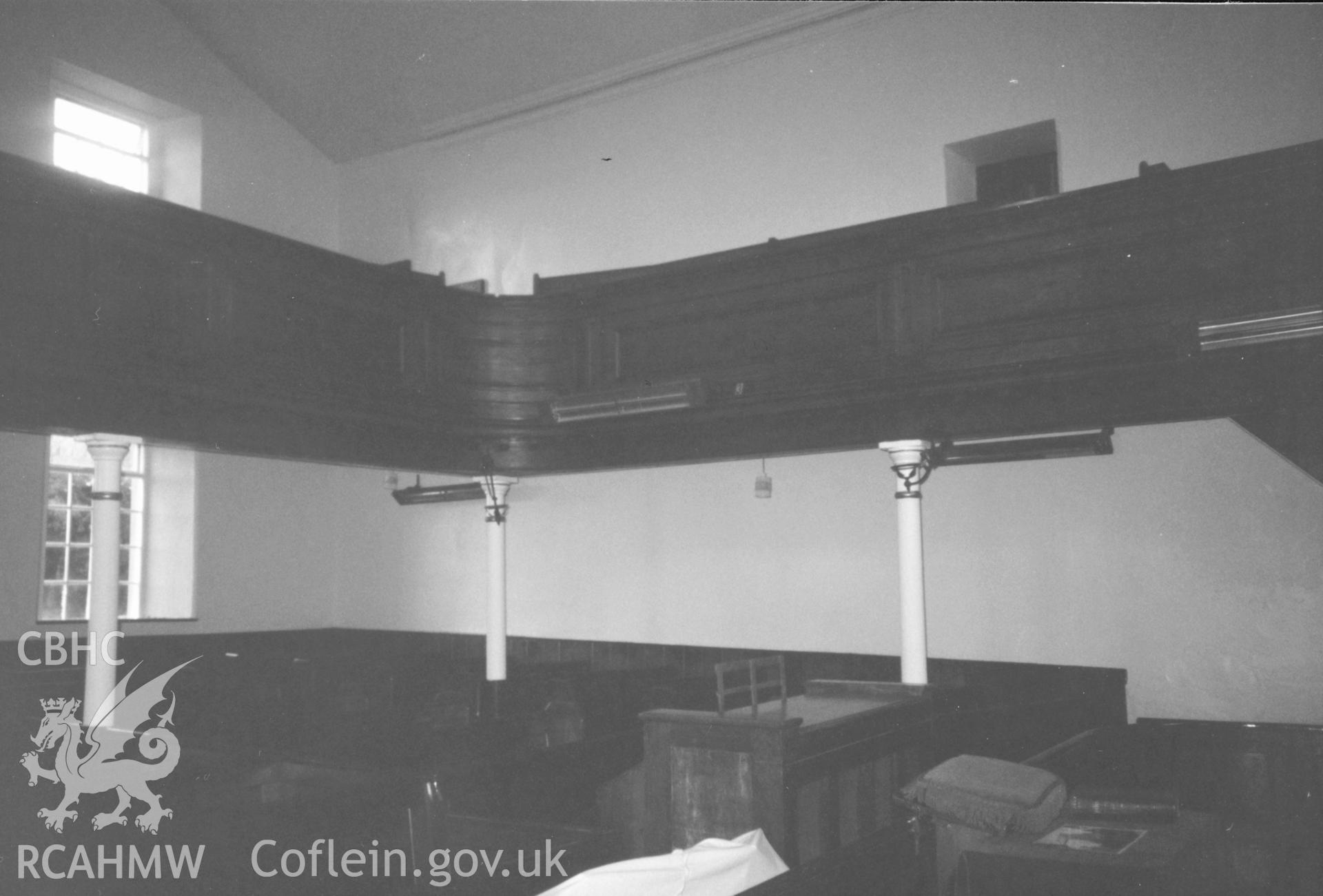 Digital copy of a black and white photograph showing an interior view of Bethania Chapel, Myddfai, taken by Robert Scourfield, 1996.