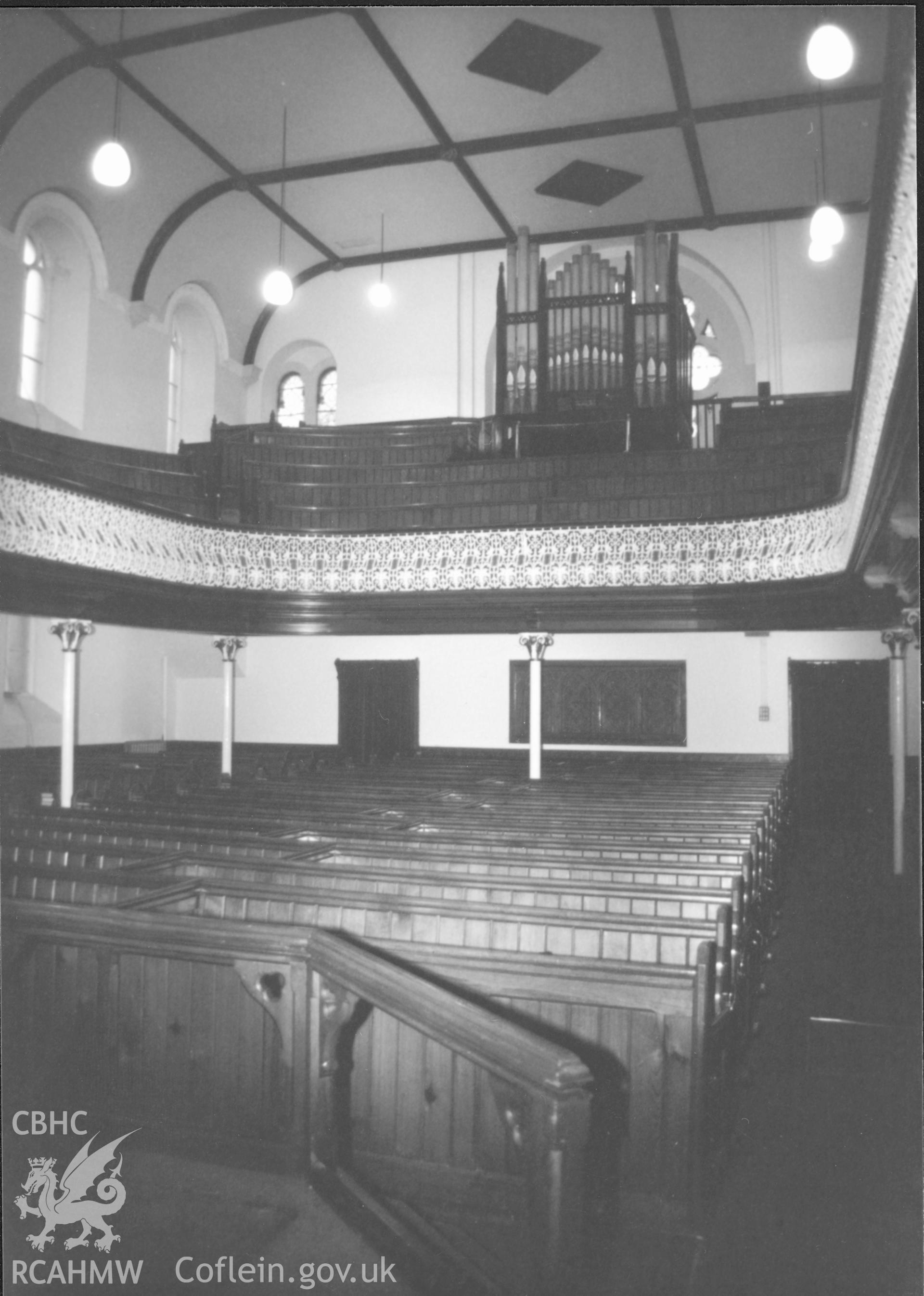 Digital copy of a black and white photograph showing an interior view of Bethesda English Baptist Chapel, Haverfordwest taken by Robert Scourfield, 1996.