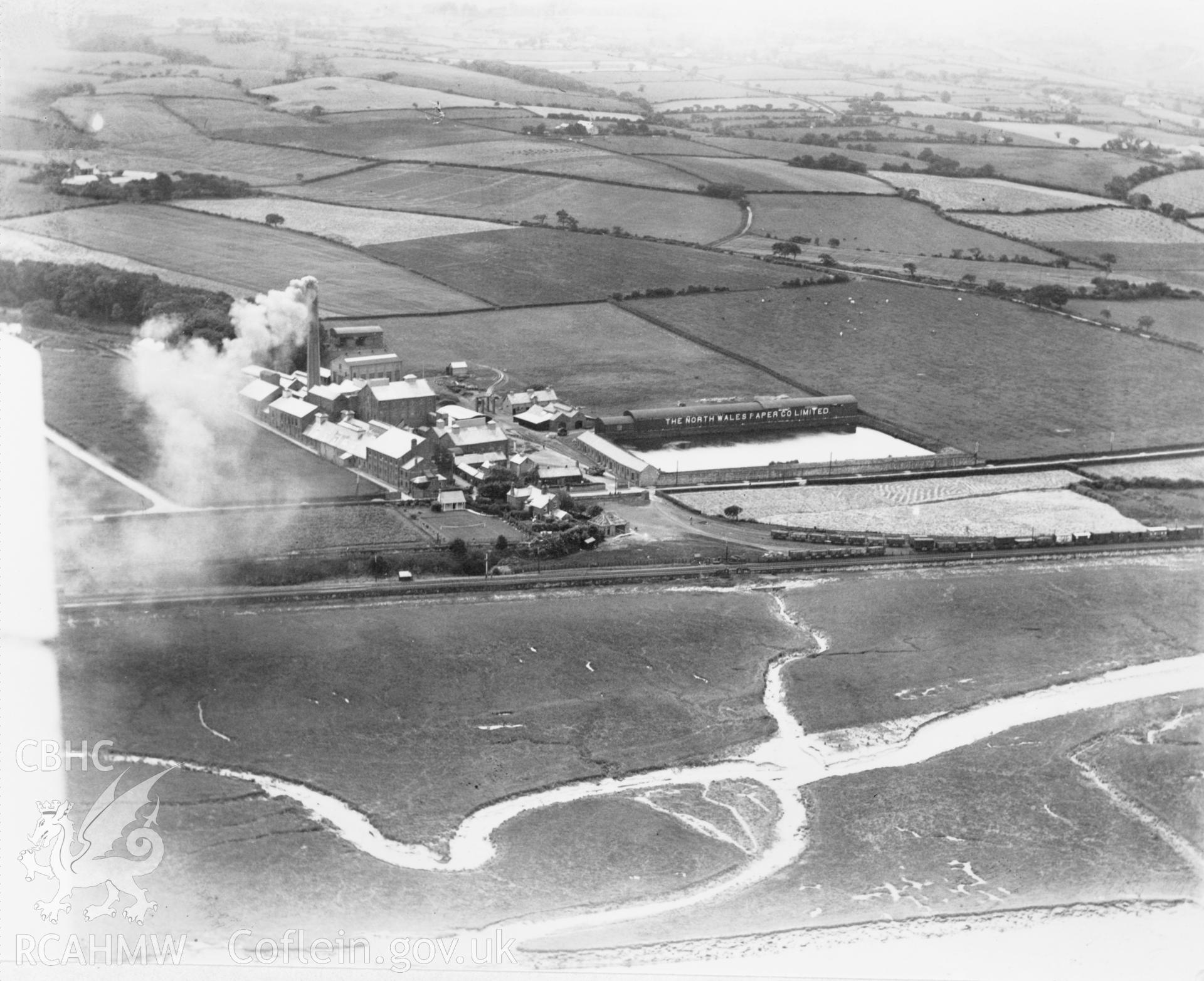 Black and white oblique aerial photograph showing Oakenholt Paper Mill, from Aerofilms album no. W17 (Flints M-Z), taken by Aerofilms Ltd and dated 1920.