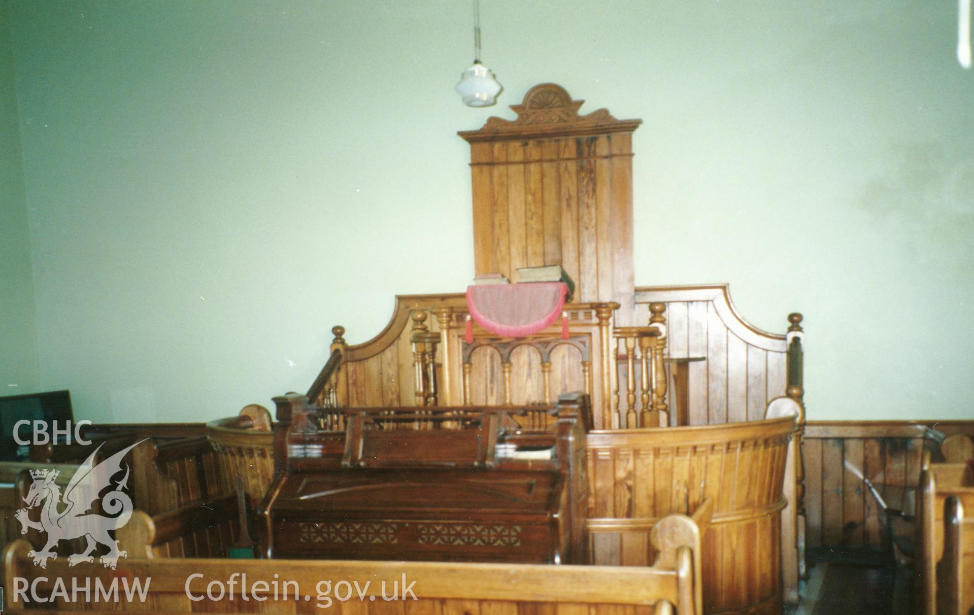 Digital copy of a colour photograph showing an interior view of Llwyndafydd Welsh Baptist Chapel,  taken by Robert Scourfield, c.1996.