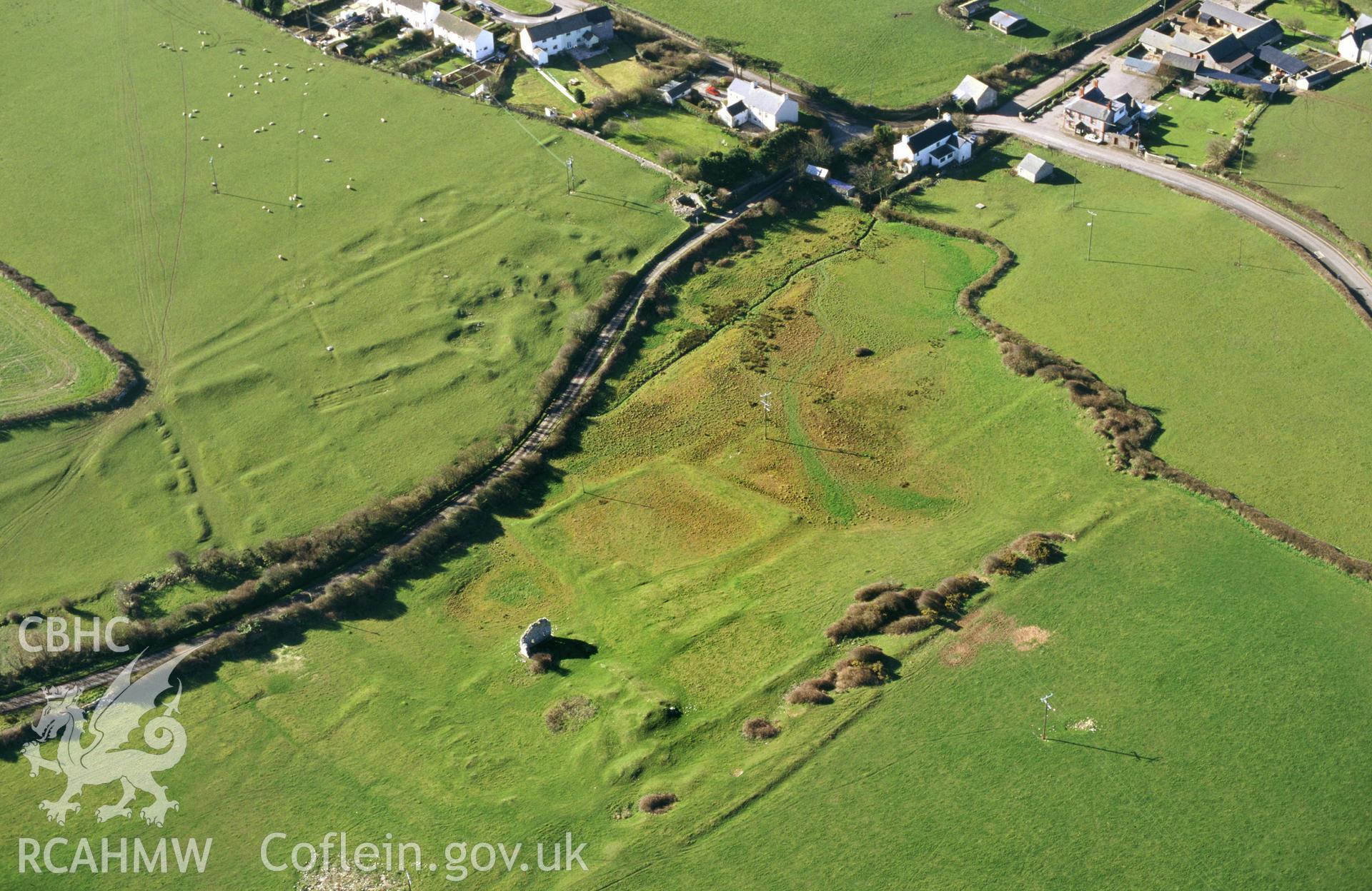 RCAHMW colour oblique aerial photograph of Marcross Earthworks. Taken by C R Musson on 29/03/1995