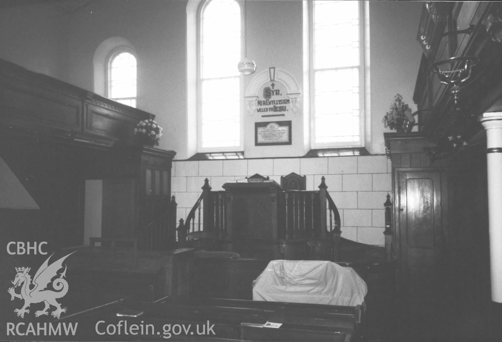 Digital copy of a black and white photograph showing an interior view of Bethania Chapel, Myddfai, taken by Robert Scourfield, 1996.