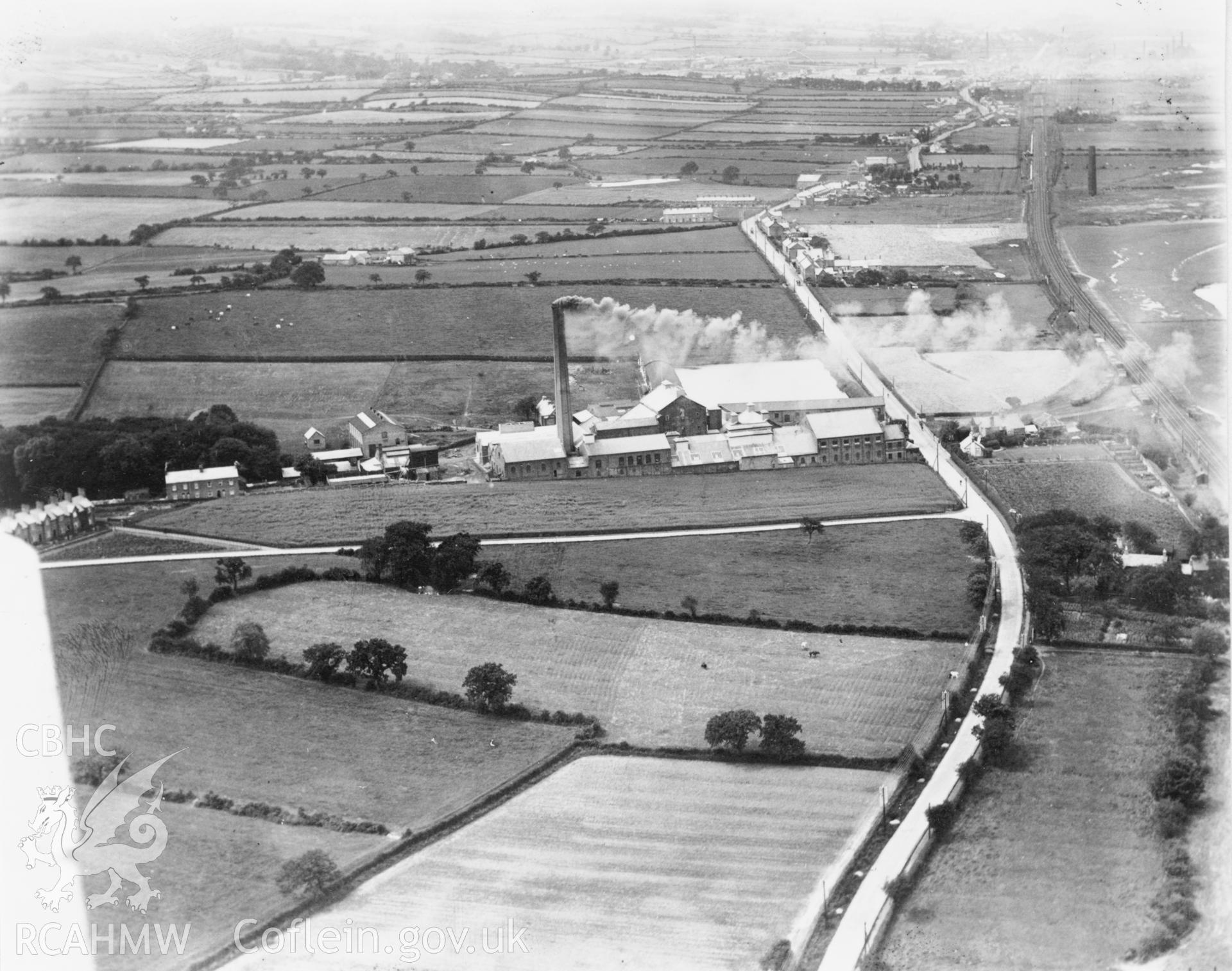 Black and white oblique aerial photograph showing Oakenholt Paper Mill from the east, from Aerofilms album no. W17 (Flints M-Z), taken by Aerofilms Ltd and dated 1920.