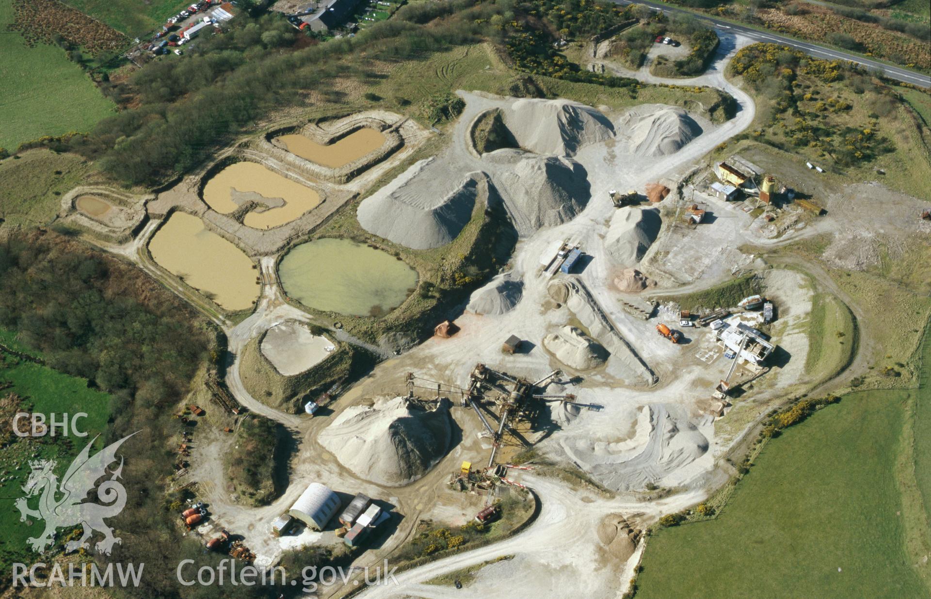 RCAHMW colour slide oblique aerial photograph of the Roman Fort and Fortlet at Penllystyn, Bryncir Quarry.