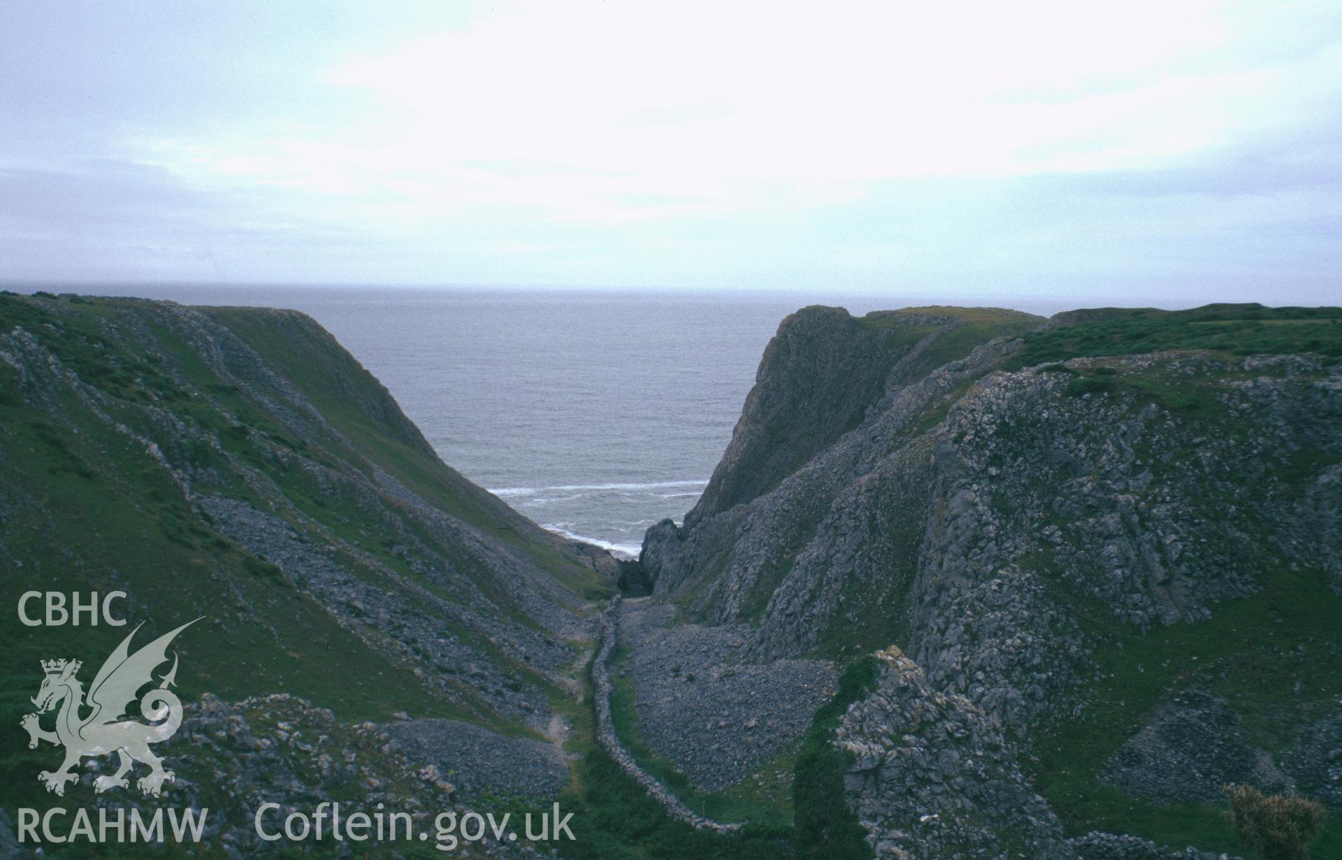 Colour slide showing a view of Foxhole Slade Cave, Paviland looking toward the Bristol Channel, taken by David Leighton, 1997.