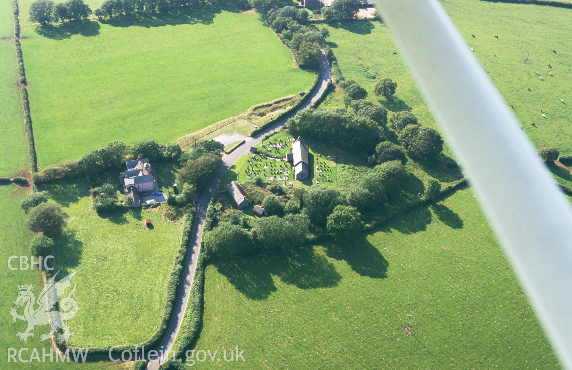 RCAHMW colour oblique aerial photograph of St. Margaret's Church, Eglwyscumin. Taken by Toby Driver on 02/09/2002