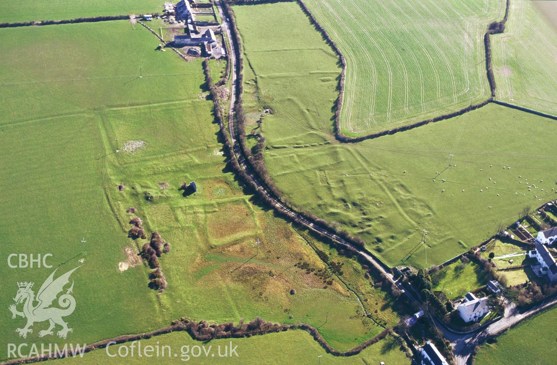 RCAHMW colour oblique aerial photograph of Marcross Earthworks. Taken by C R Musson on 29/03/1995