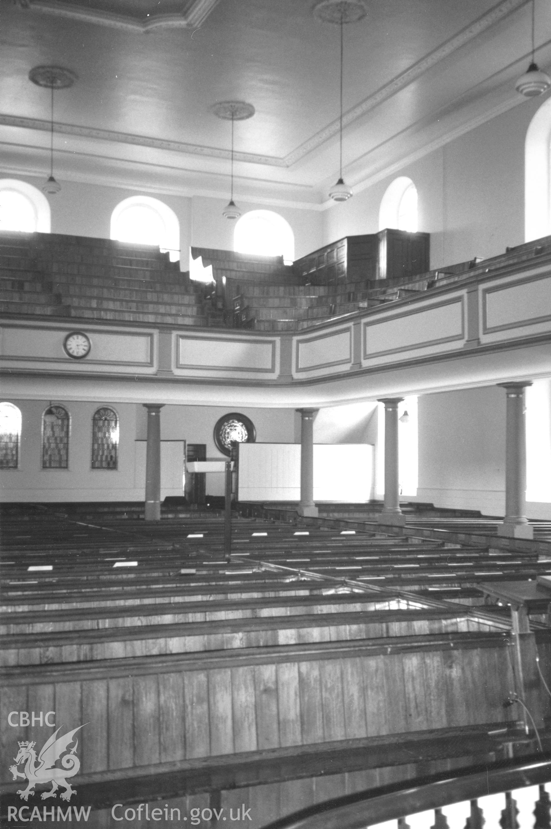 Digital copy of a black and white photograph showing an interior view of Zion Wesleyan Methodist Chapel, Pembroke Dock, taken by Robert Scourfield, c.1996.