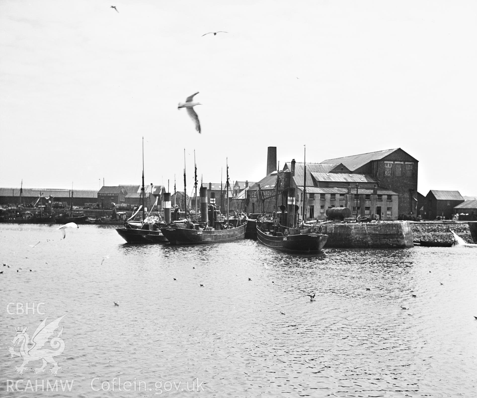 Black and white photograph showing general exterior view of the Ice Factory at Milford Haven, from across the harbour.