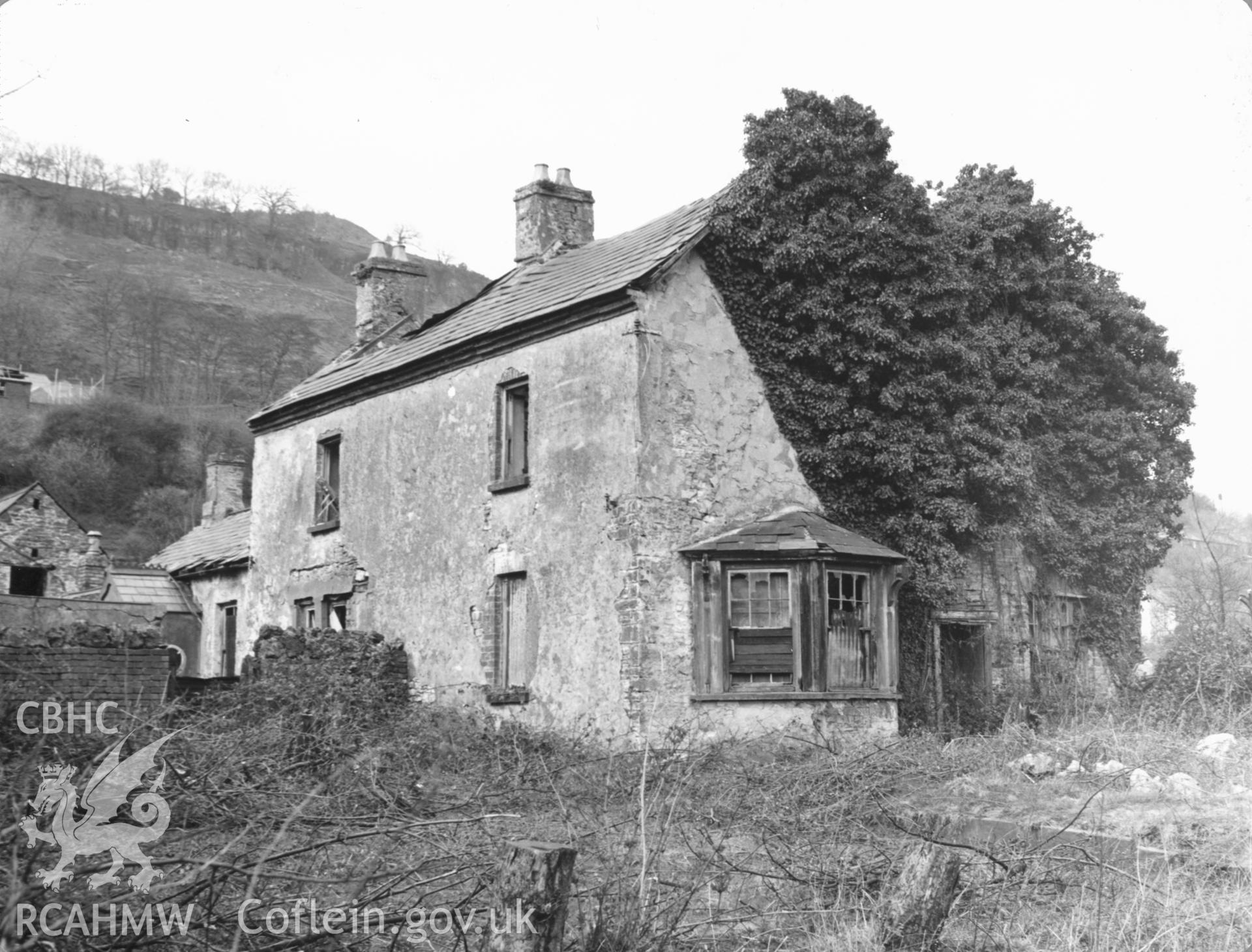 Mounted black and white photograph showing Fountain Hall, Ystalyfera in a state of disrepair, of unknown date and origin.