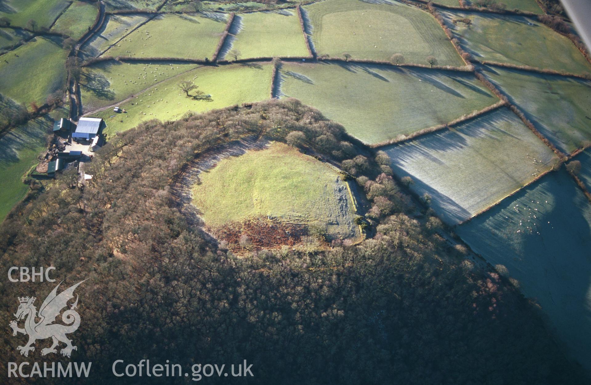 RCAHMW colour slide oblique aerial photograph of Craig Gwrtheyrn hillfort, Llanfihangel-ar-arth, taken on 19/12/1999 by Toby Driver