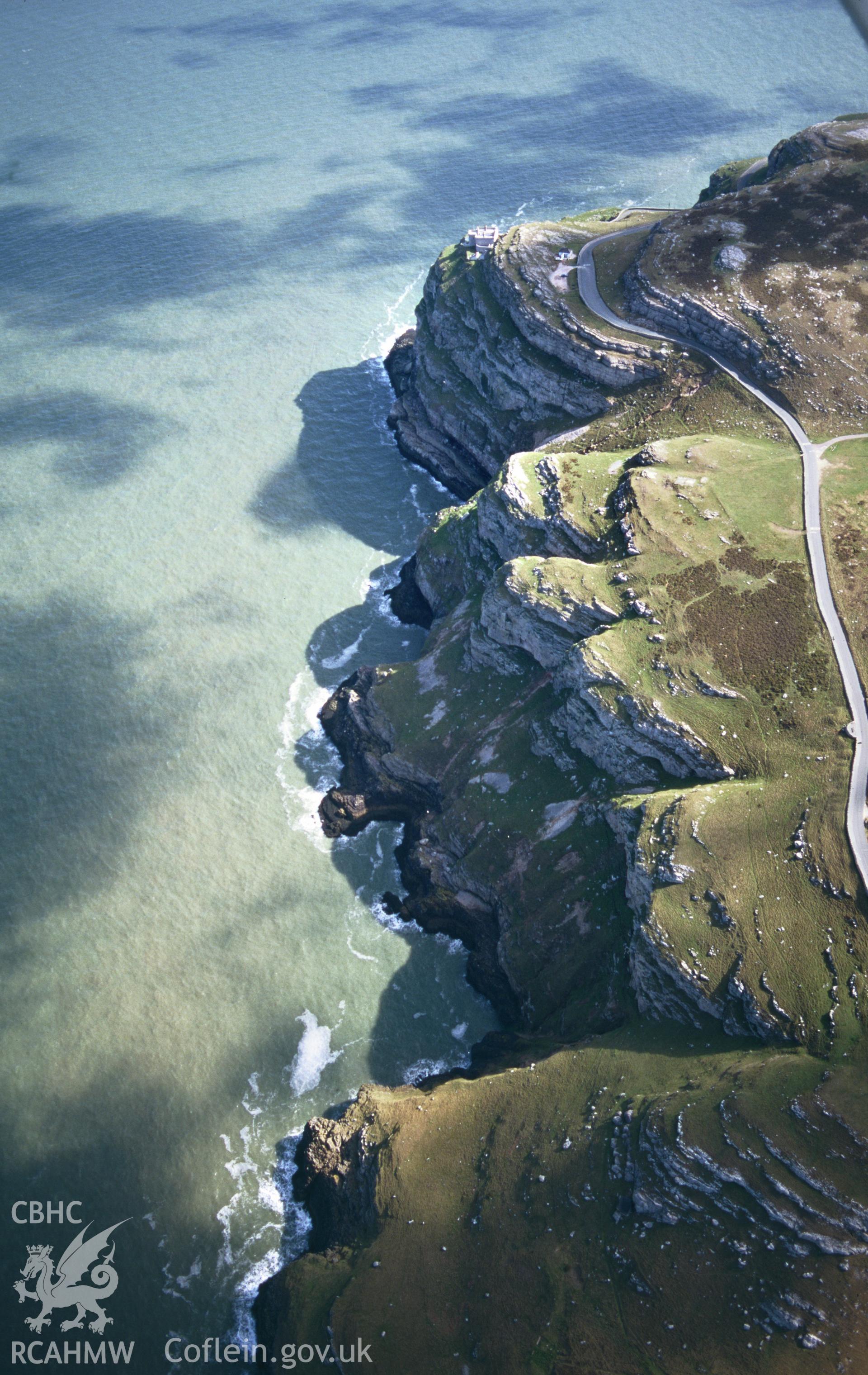 RCAHMW colour slide oblique aerial photograph of Great Orme's Head Hut Settlement, Llandudno, taken on 18/04/1998 by Toby Driver