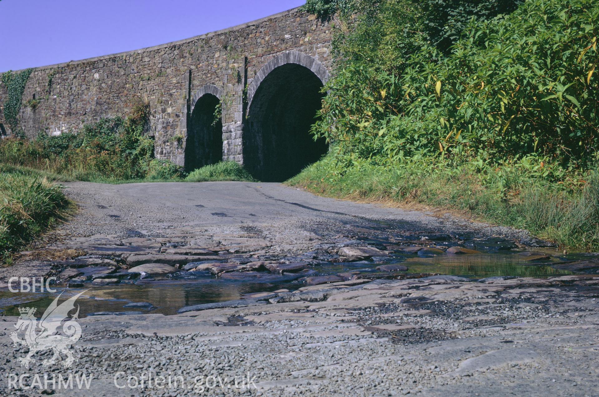 35mm colour slide showing Kilgetty Road Bridge crossing the line of Saundersfoot Railway, Pembrokeshire (note tram tunnel next to road bridge) by Dylan Roberts.