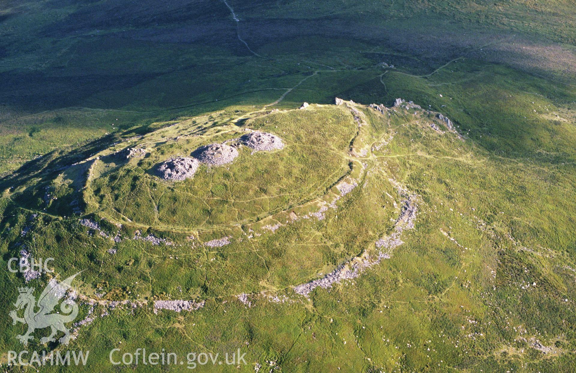 Slide of RCAHMW colour oblique aerial photograph of Foel Drygarn Camp, taken by C.R. Musson, 14/7/1989.