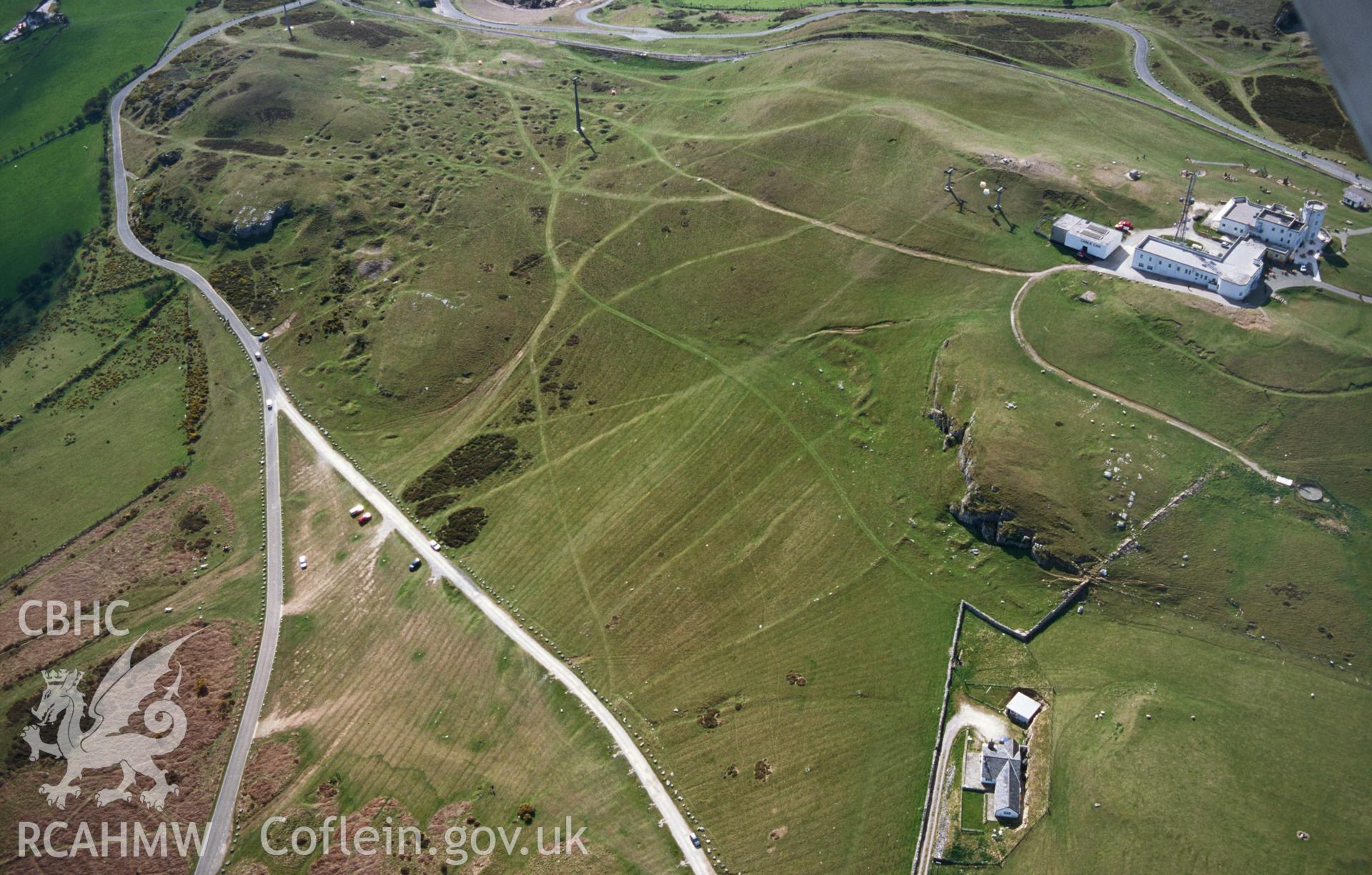 RCAHMW colour slide oblique aerial photograph of the settlement on the Great Orme's Head, taken on 18/04/1998 by Toby Driver