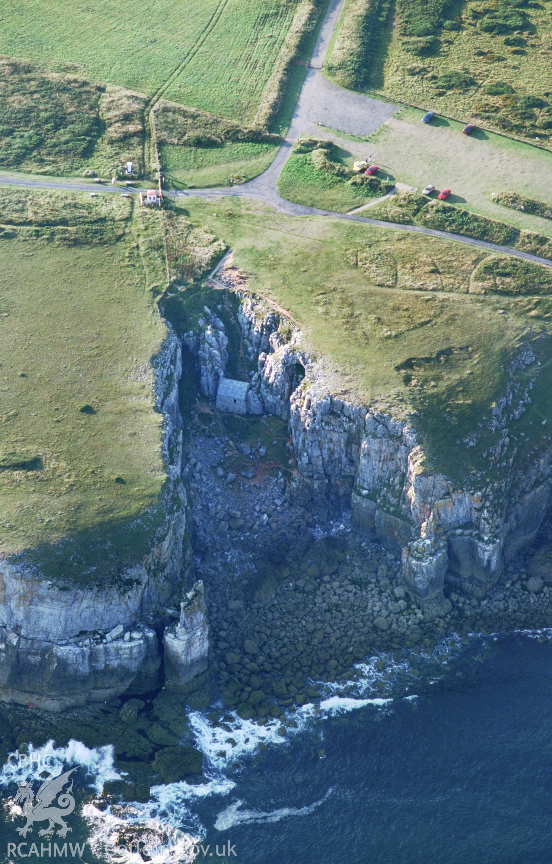 RCAHMW colour slide oblique aerial photograph of St Govan's Chapel, Stackpole, taken by T.G.Driver on the 23/08/2000