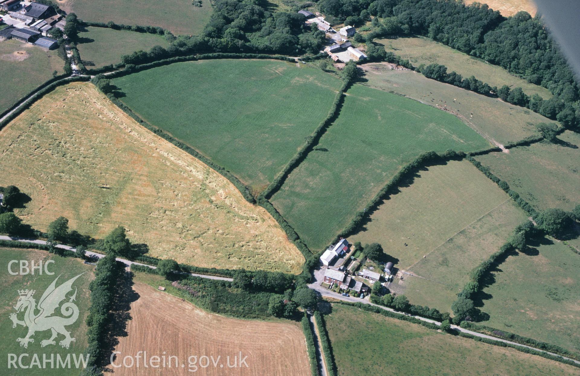 RCAHMW colour slide oblique aerial photograph of cropmark enclosure at Plas-y-parc, Clynderwen, taken by C.R.Musson on the 21/07/1996