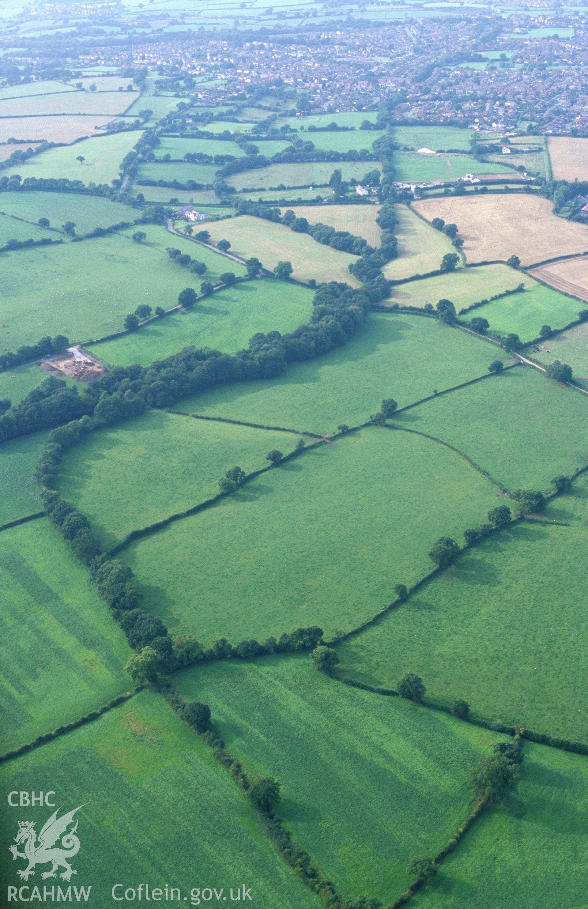 RCAHMW colour slide oblique aerial photograph of Wat's Dyke: From SE of Whitehouse Farm To SW of Garreg Llwyd, Mynydd Isa, taken by T.G.Driver on the 30/08/2000