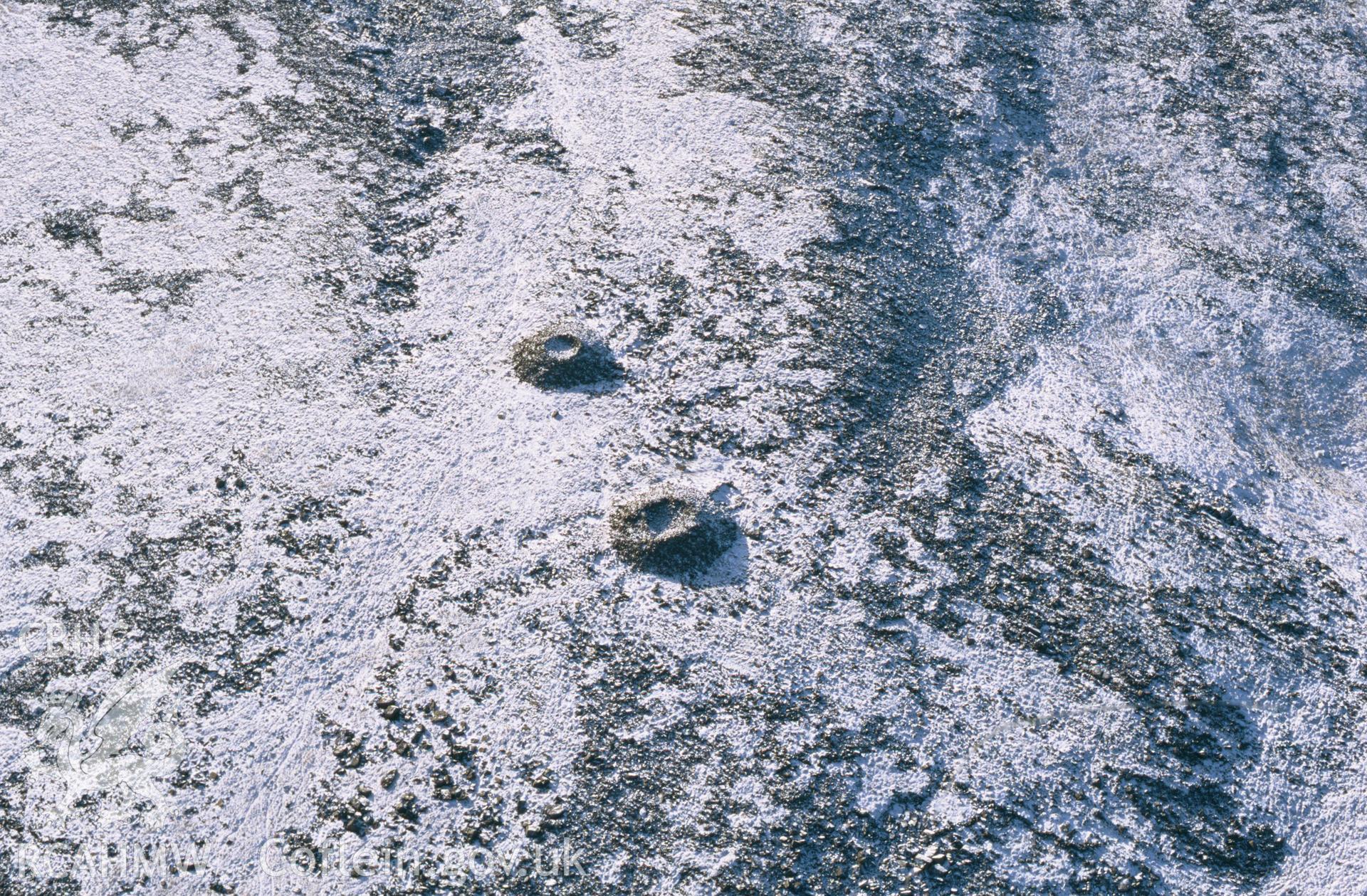 RCAHMW colour oblique aerial photograph of Carnau'r Gareg-las, cairns. Taken by Toby Driver on 10/01/2003