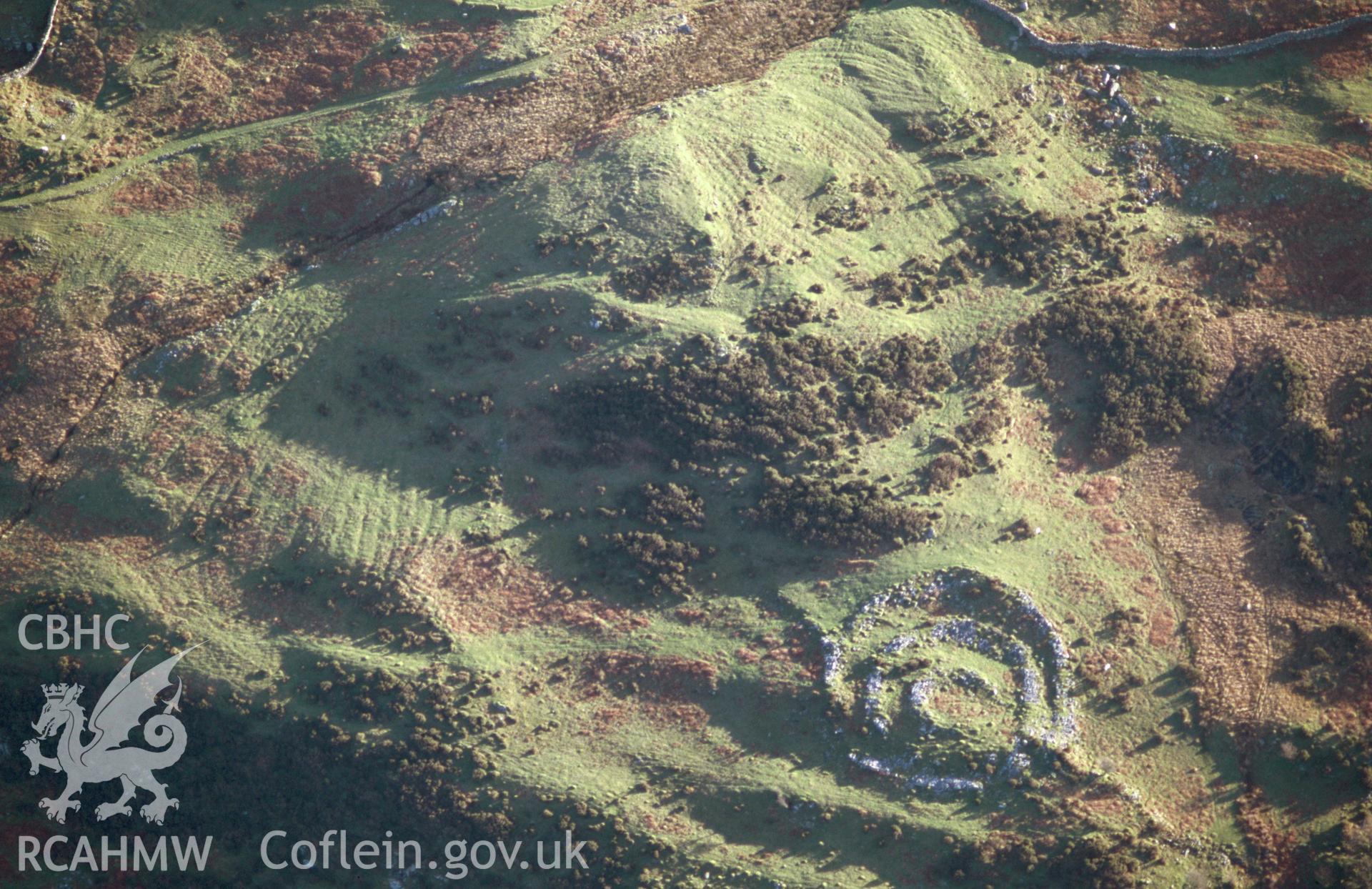 Slide of RCAHMW colour oblique aerial photograph of Maes y Caerau Homestead, Talsarnau, taken by T.G. Driver, 2005.