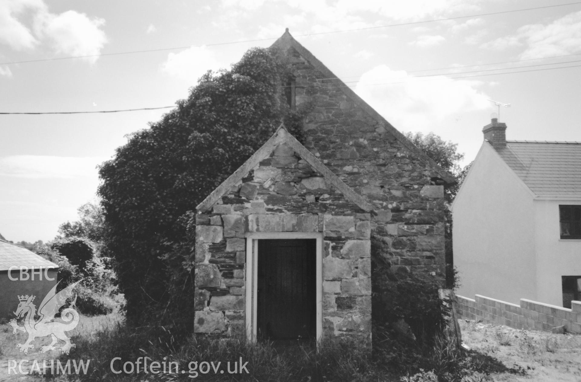 Digital copy of a black and white photograph showing an exterior view of Little Newcastle School, Puncheston, taken by Robert Scourfield, c.1996.