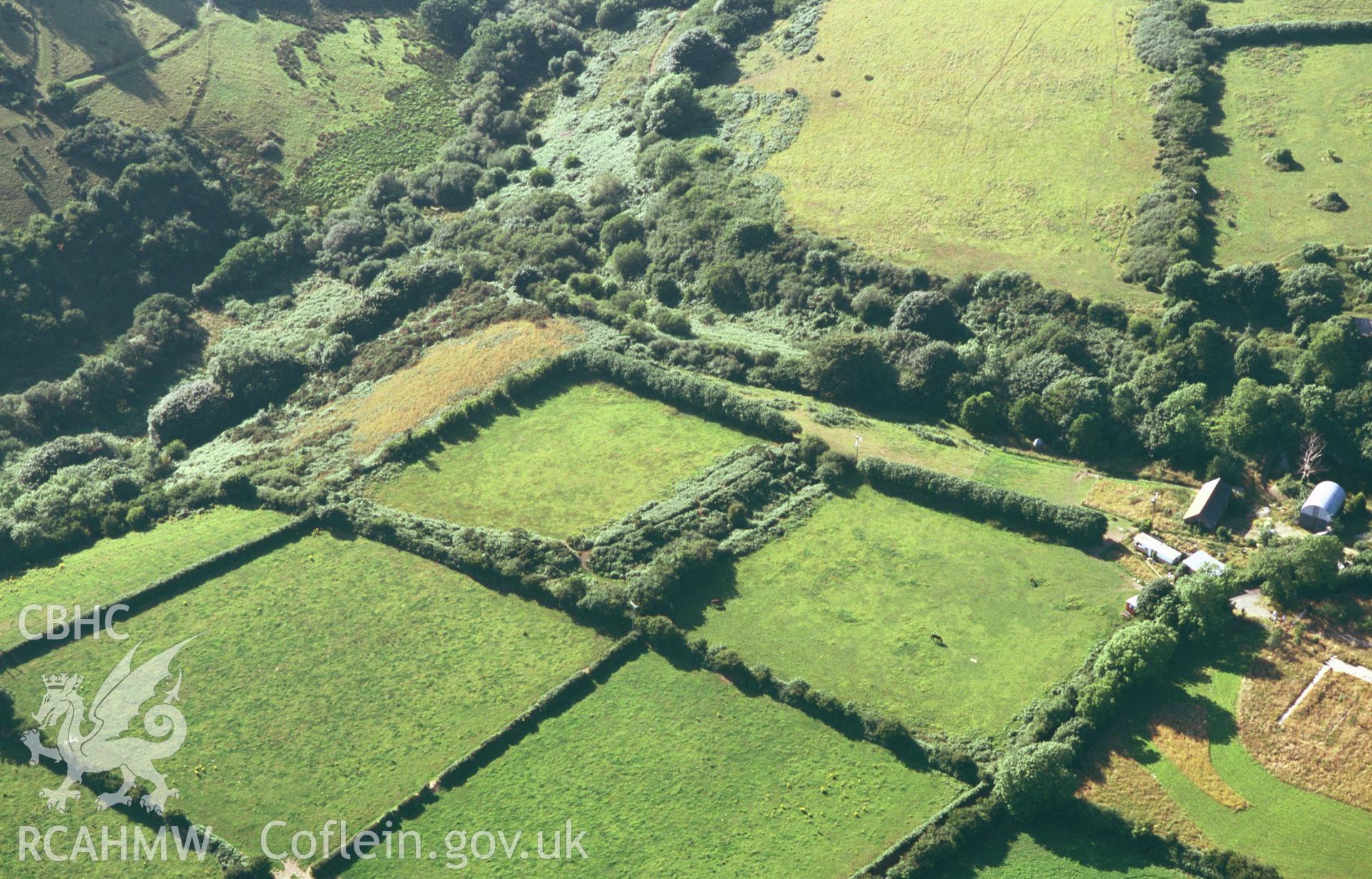 RCAHMW colour oblique aerial photograph of Castell Blaen-Igau, Brynhoffnant, earthwork enclosure; view from south-east. Taken by C R Musson on 24/07/1995