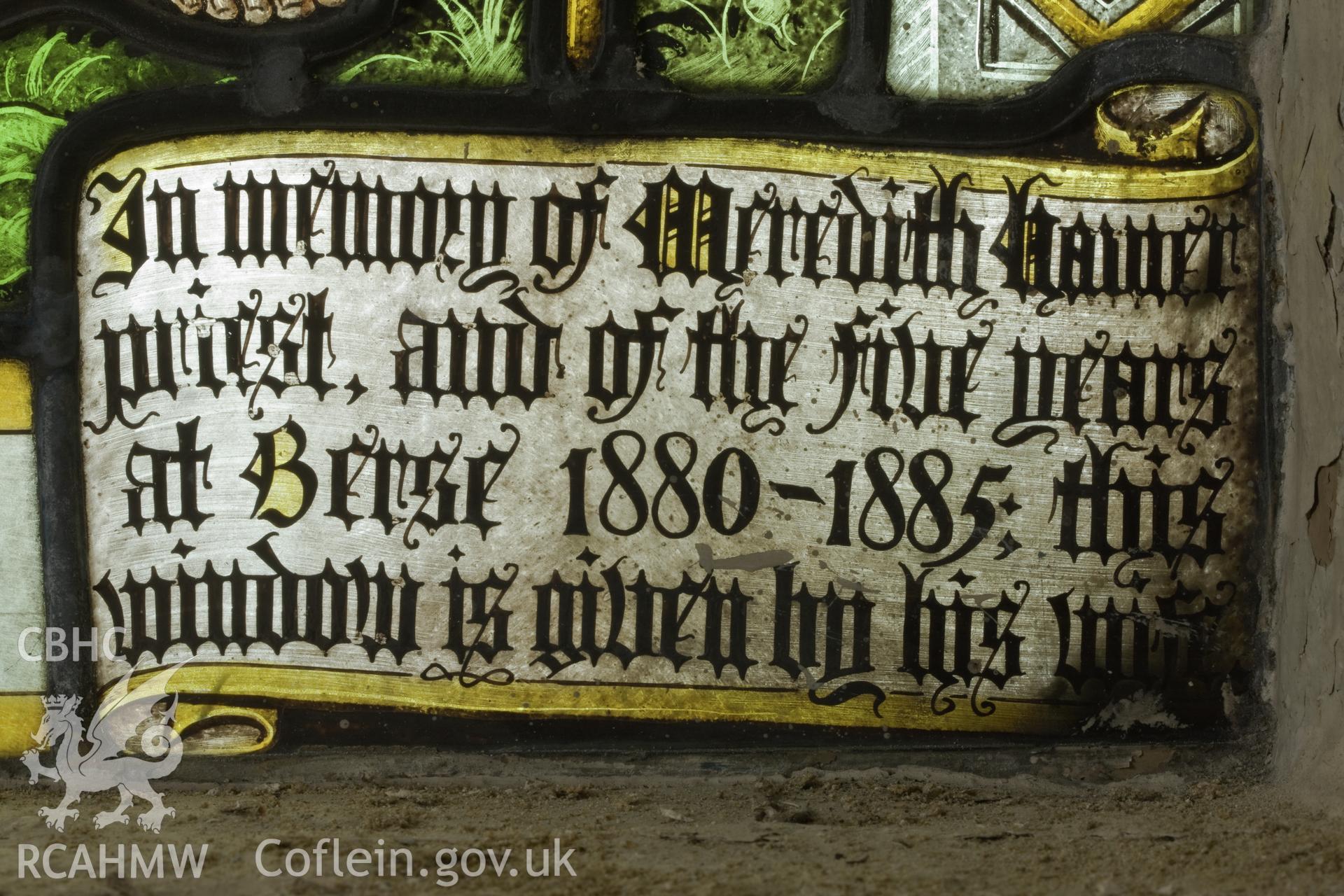 Dedication on stained glass.