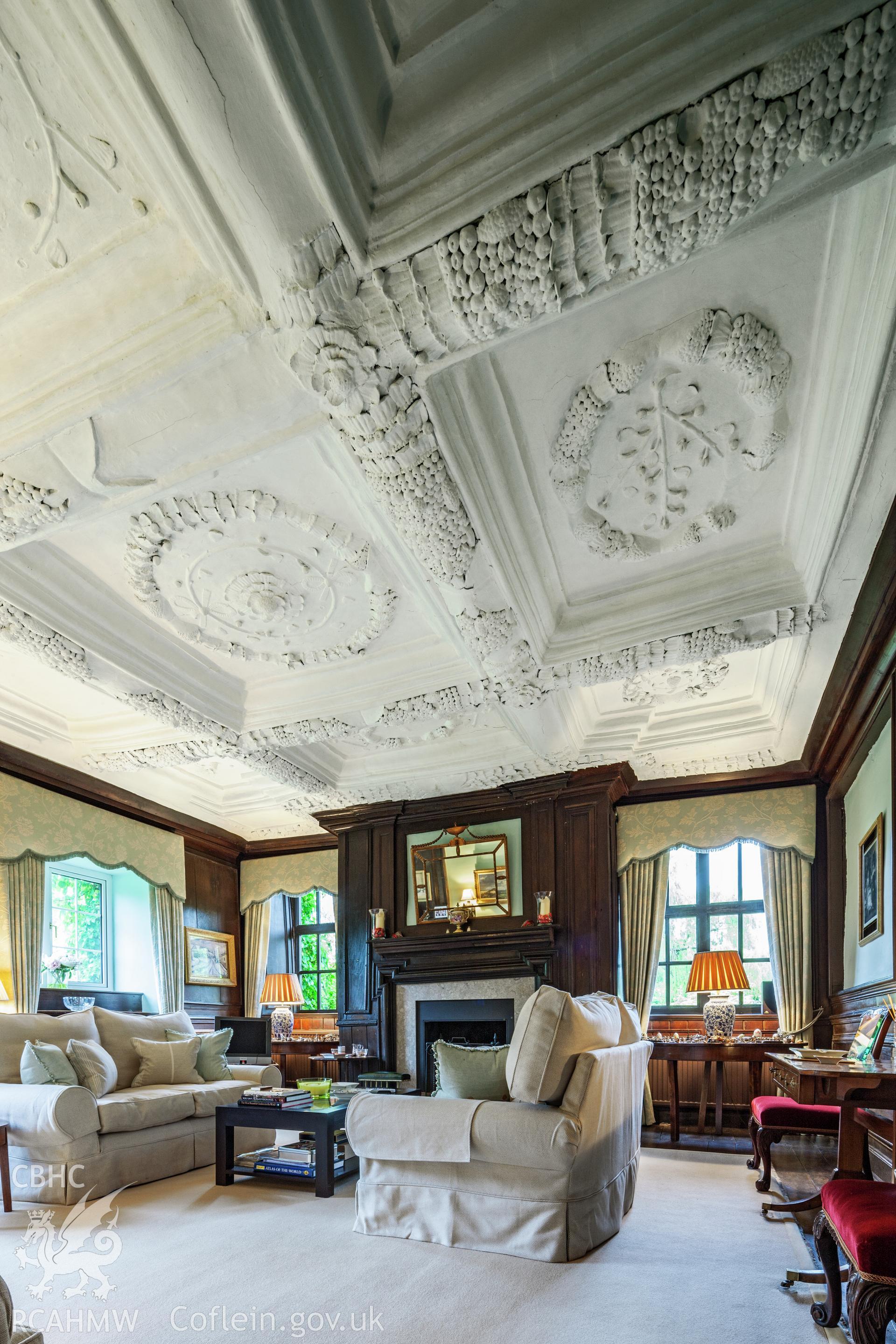 Interior of parlour with decorated plaster ceiling.