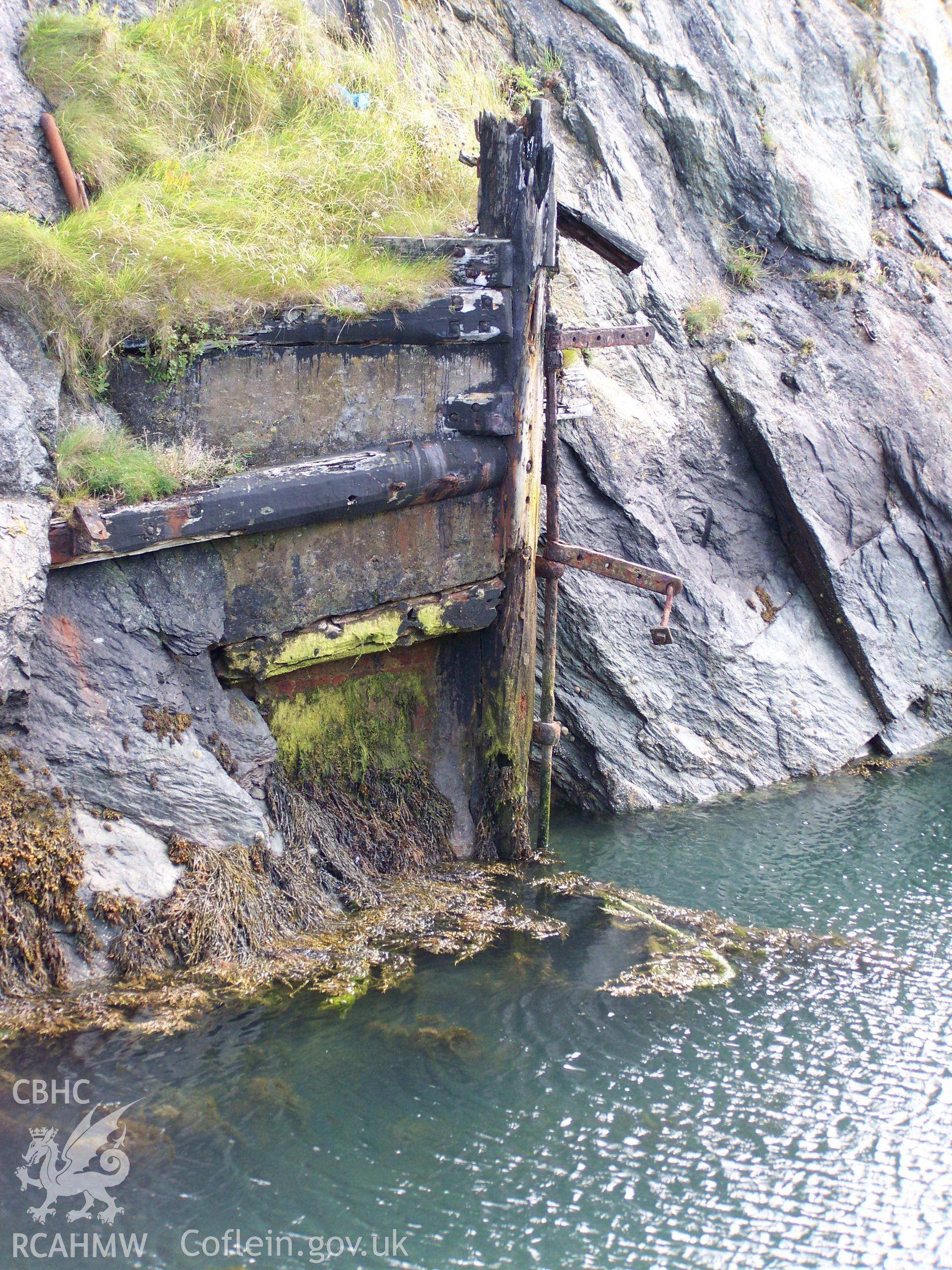 The dock gate support and surviving hinge on the southern side of the dry dock.