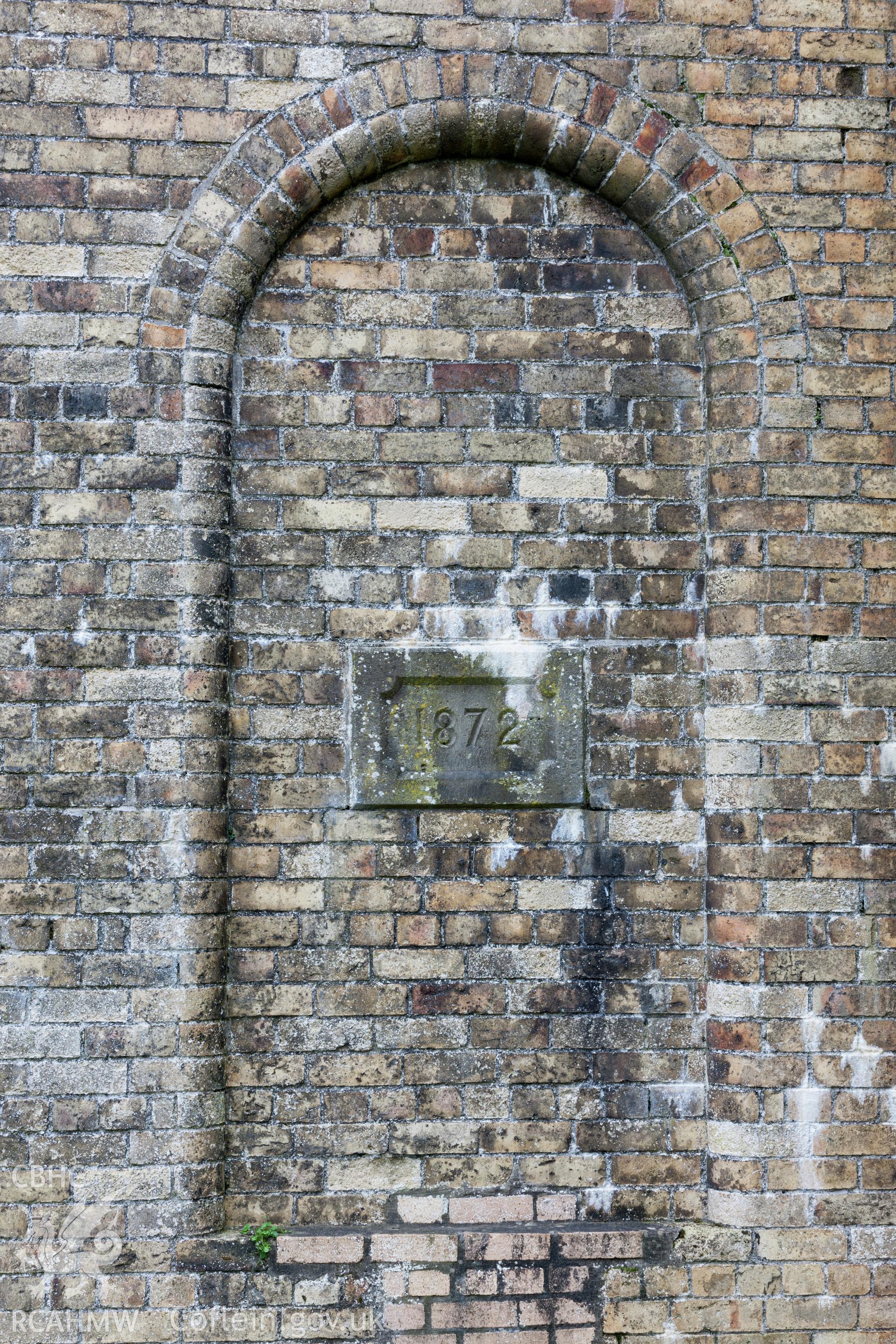 Chimney base, with date stone detail.