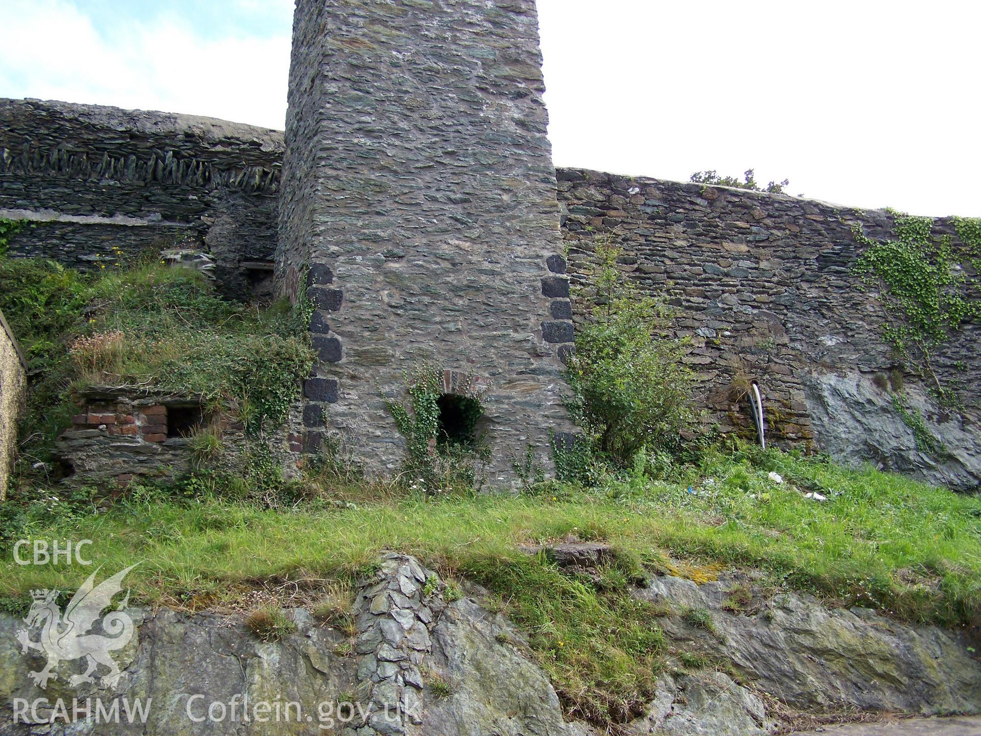 View of the base of the chimney showing the second fireplace (chimney base?) to its eastern side