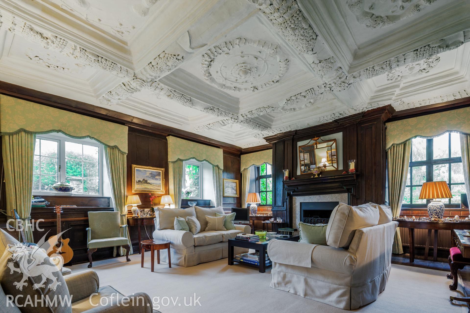 Interior of parlour with decorated plaster ceiling.