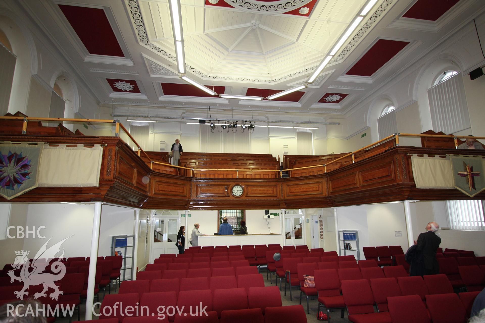 Internal view towards gallery, showing clock and panelling