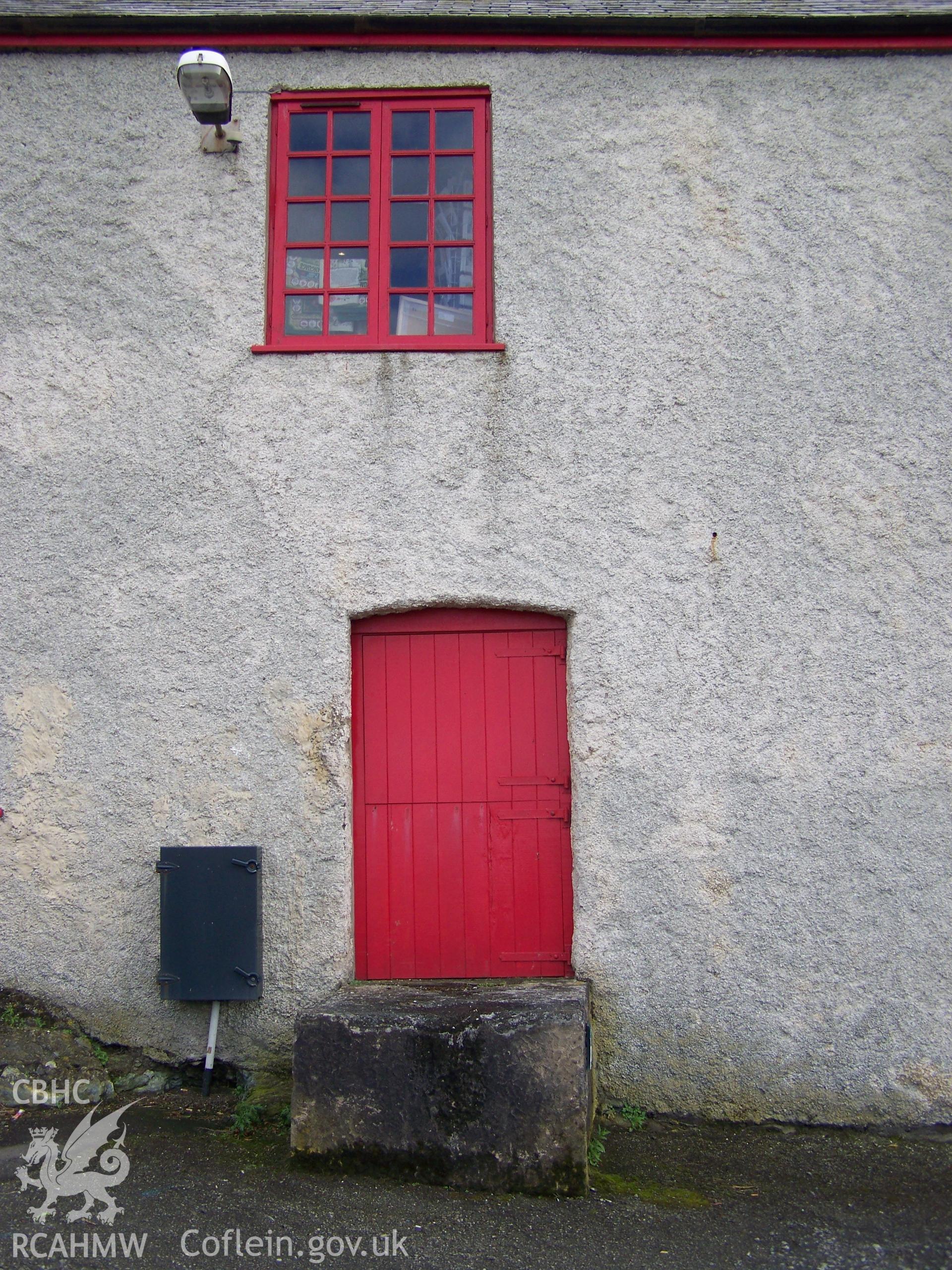 Detail from the northern elevation showing ground floor door and upper floor window.