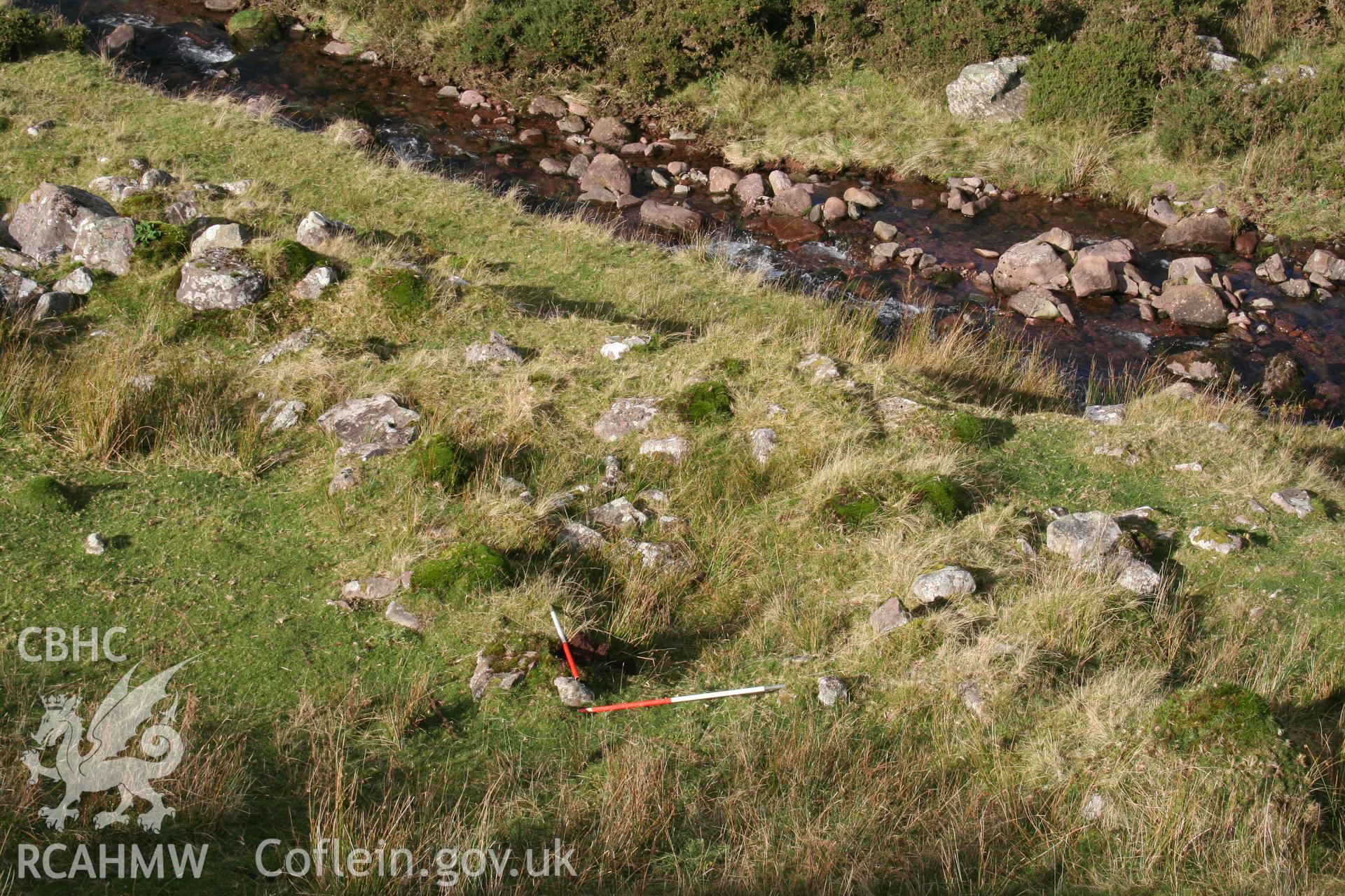 Shelter seen from the south-east; 2 x 1m scales at upper end of structure.