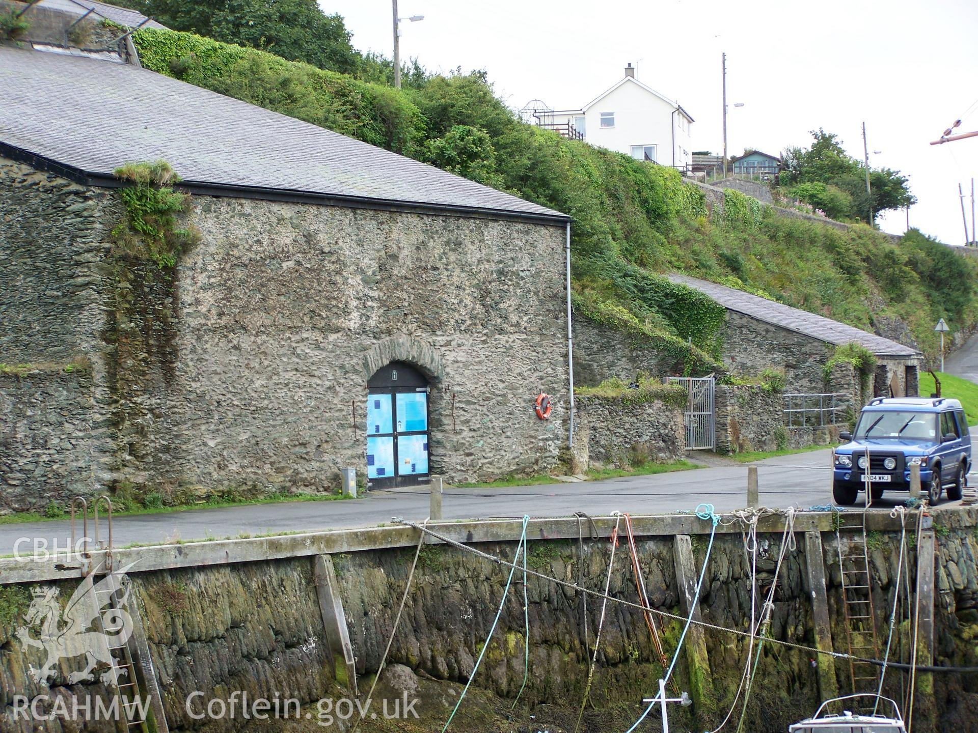 The roofed bin used to store copper ore viewed from the baulks handling quay to the northeast