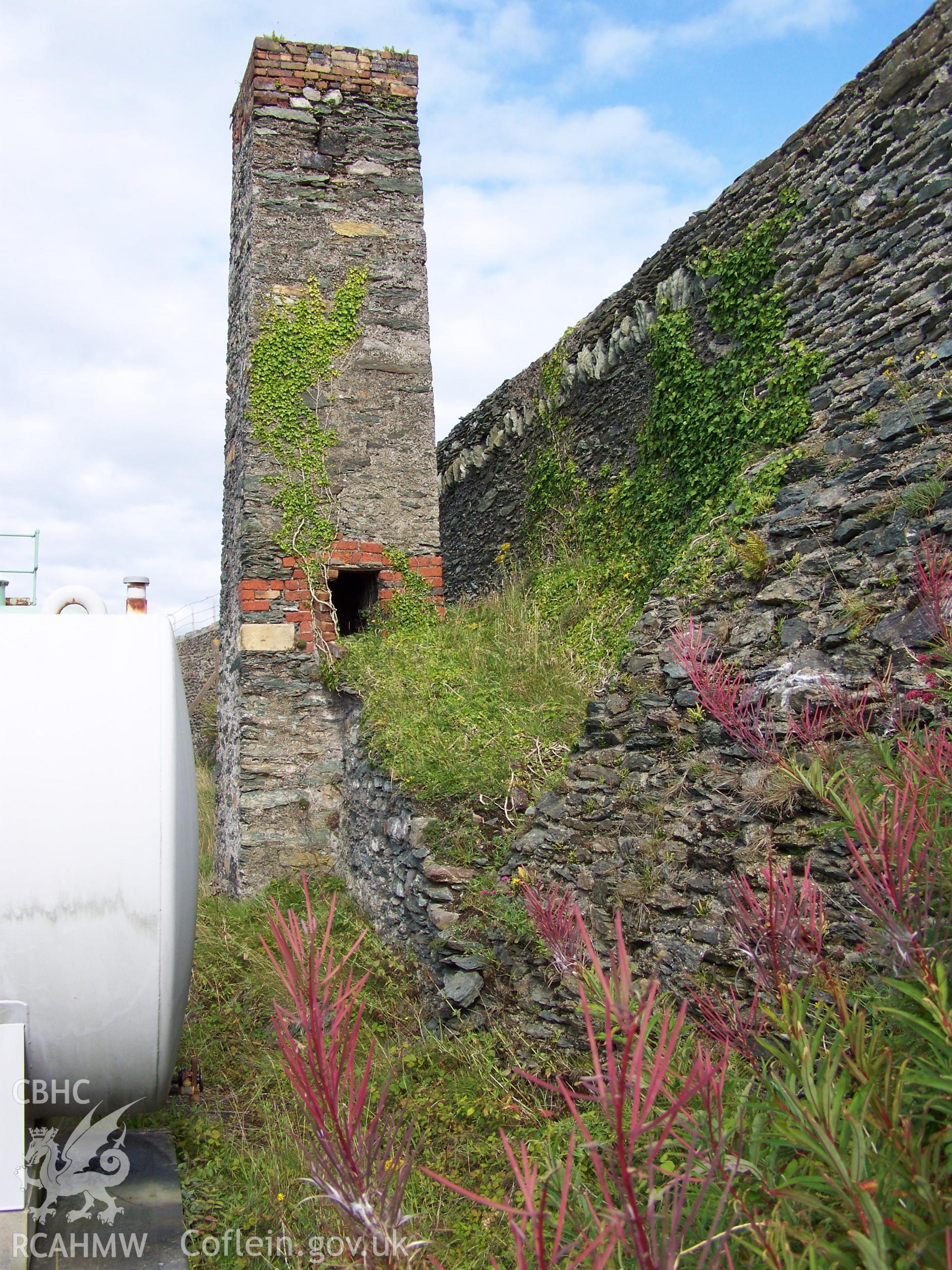 Viewed from the west inside the wall of the former shipyard, with butressing to wall in foreground.