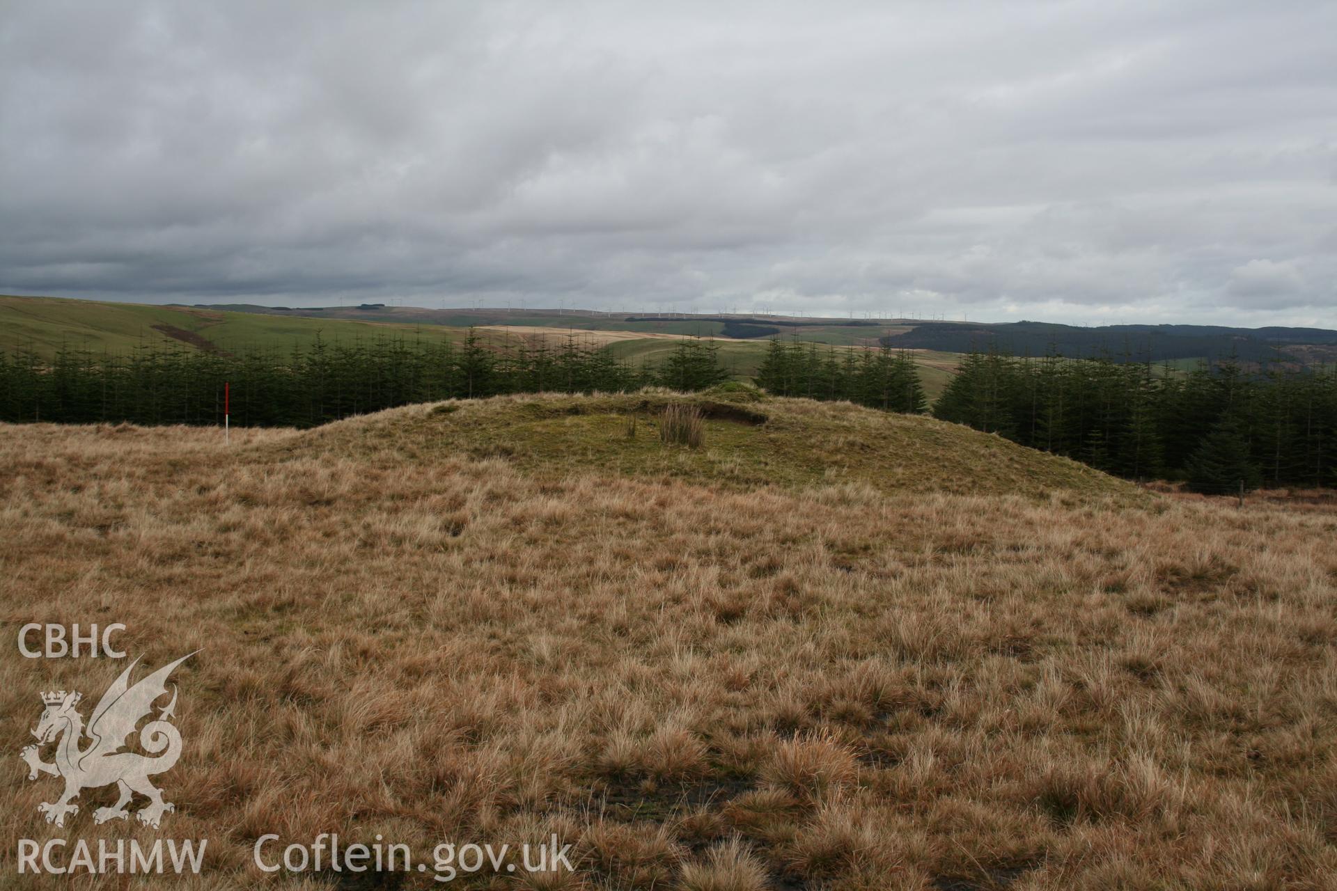 View from the west, erosion scar visible; 1m scale.