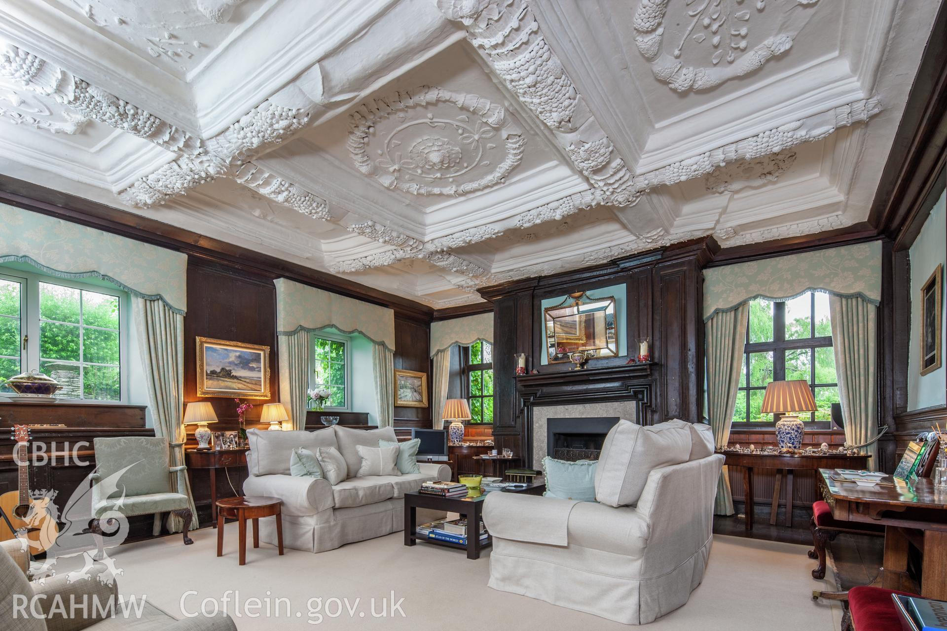 Interior of parlour with decorated plaster ceiling.