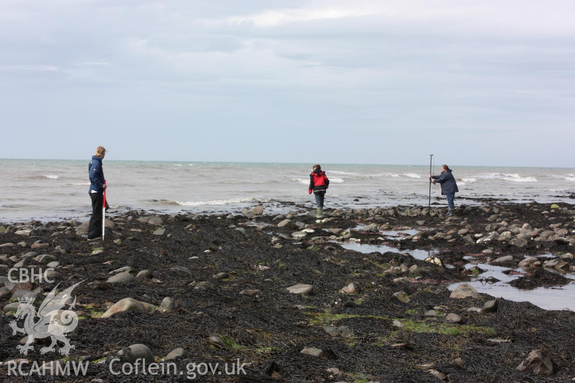 View of cod end or sluice, looking west. RCAHMW staff (centre and right) standing on east-west arm and local resident (left) standing on north-south arm.