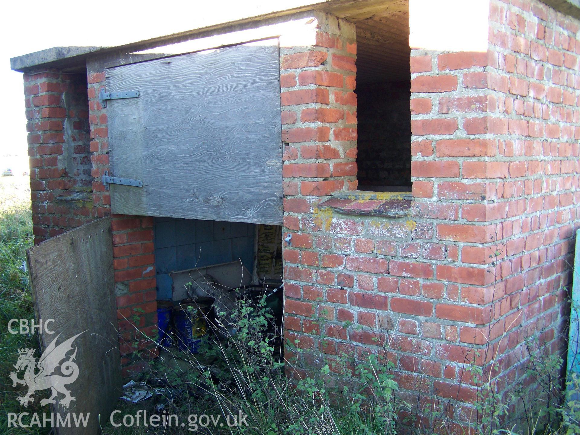 Southern elevation showing wide door and flanking narrow window apertures