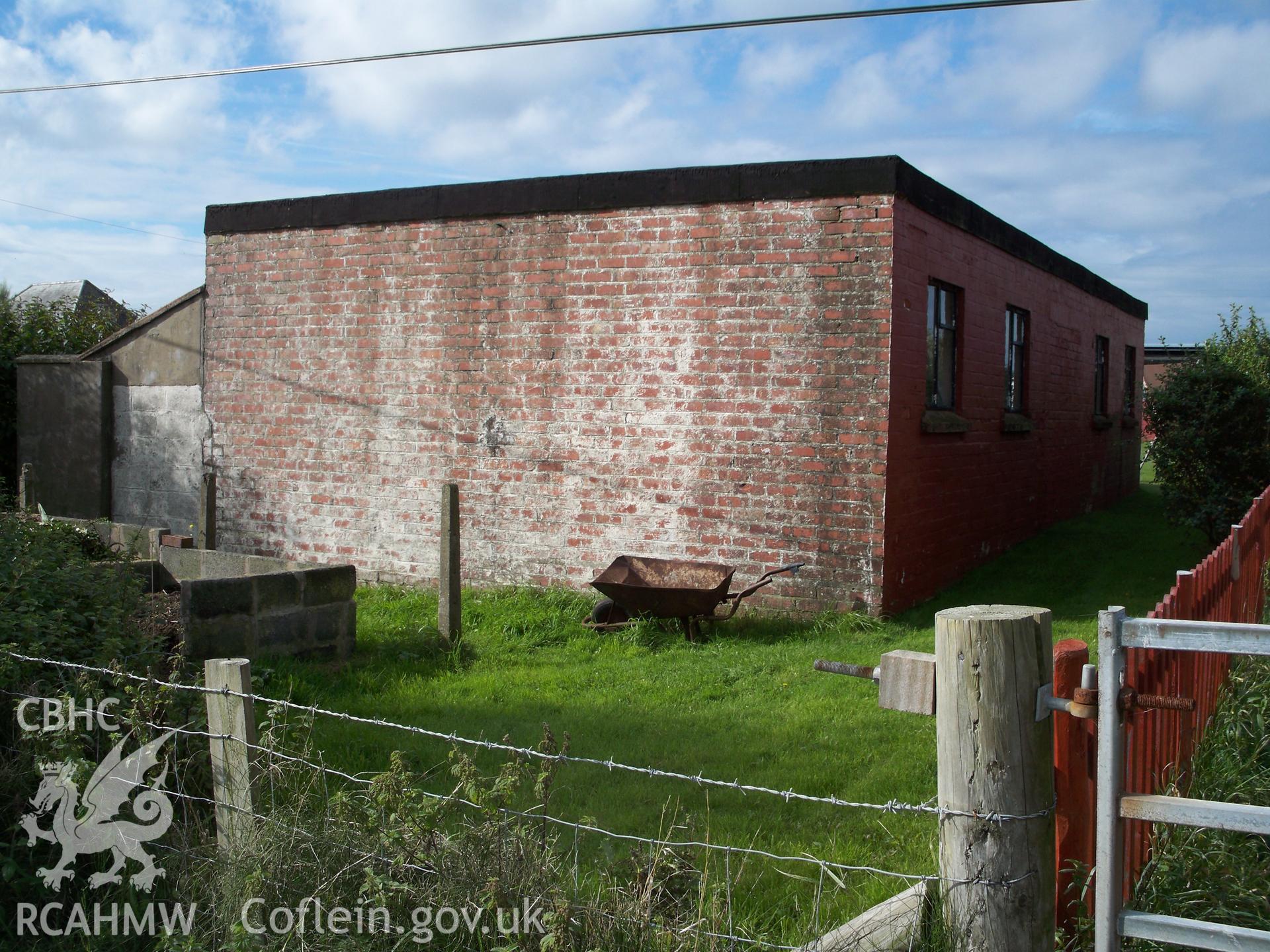 Eastern elevation of workshop with probably contemporary enclosure abutting to southern side