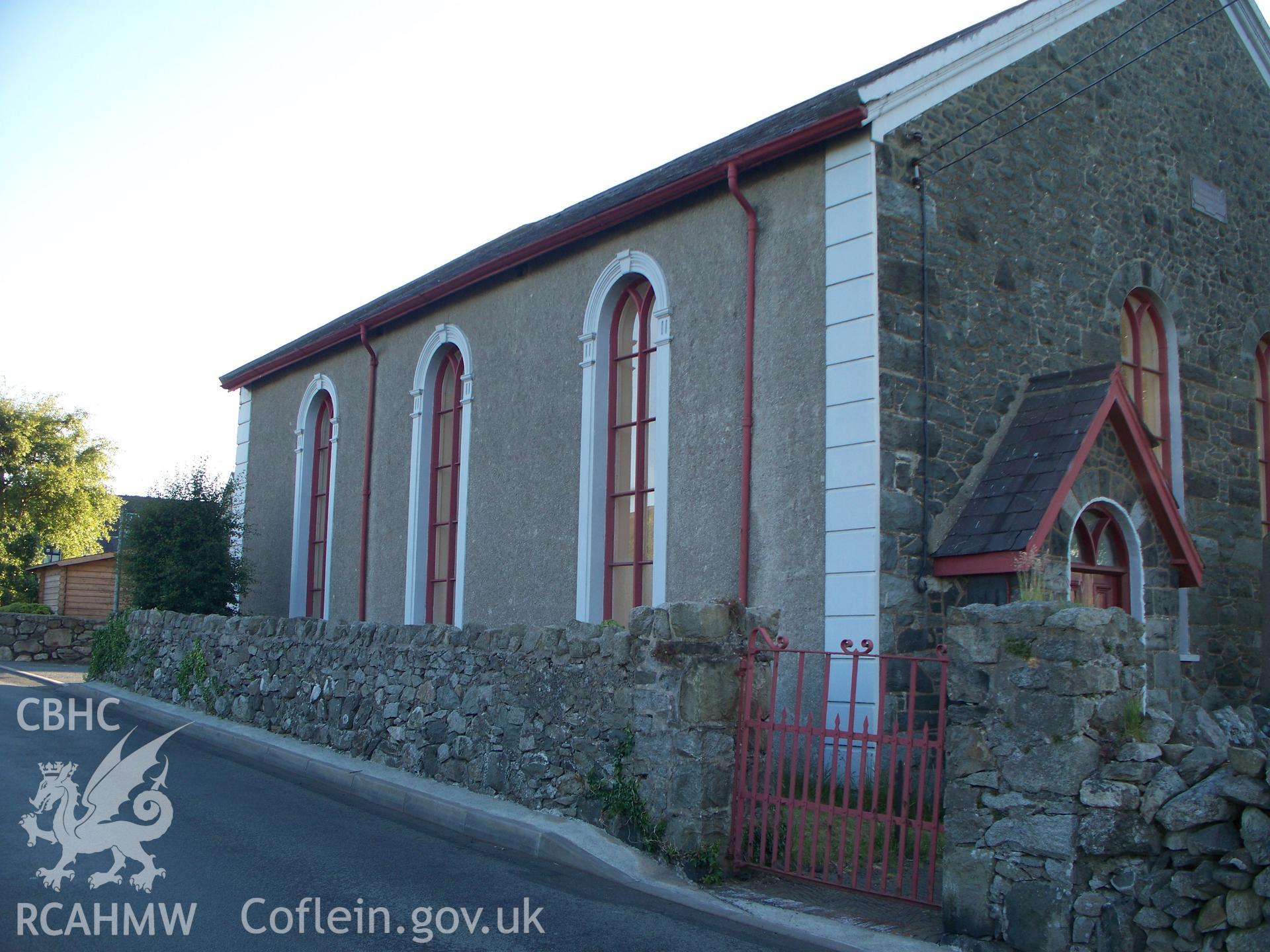 Left-hand front entrance and south east side view.