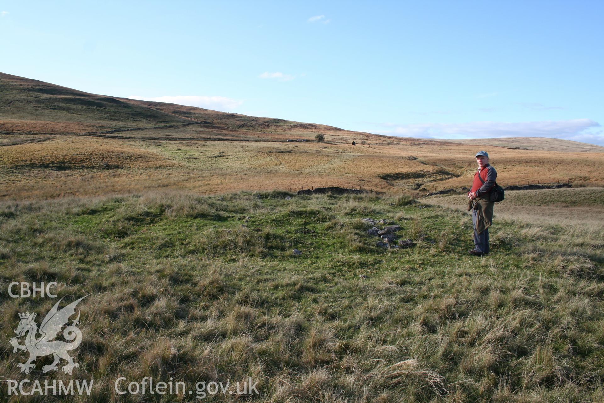 Cairn viewed from the south-east; Maen Llia (NPRN 84541) in the distance, below horizon.