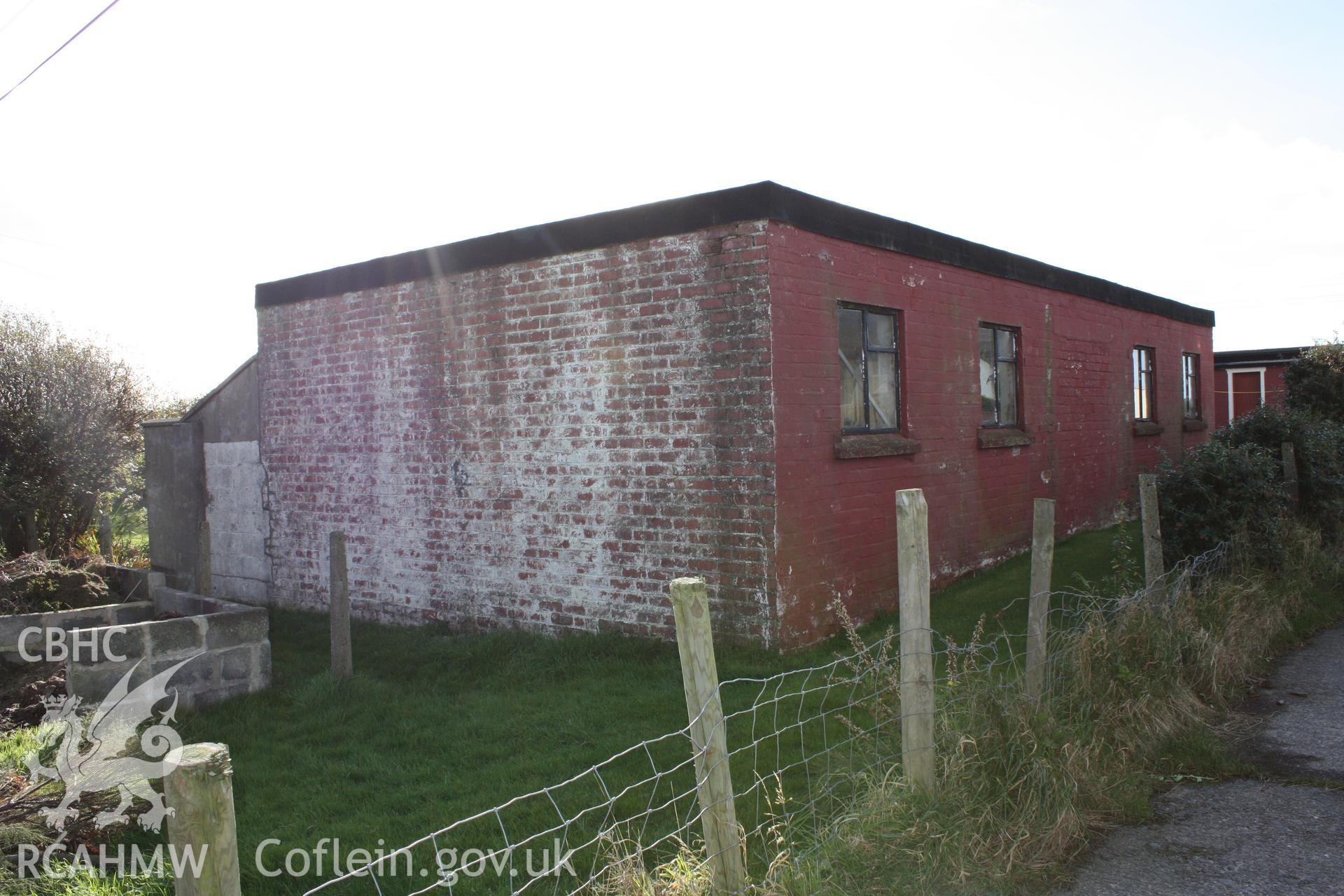 Rear wall of the former workshop viewed from the military access road (looking southwest).