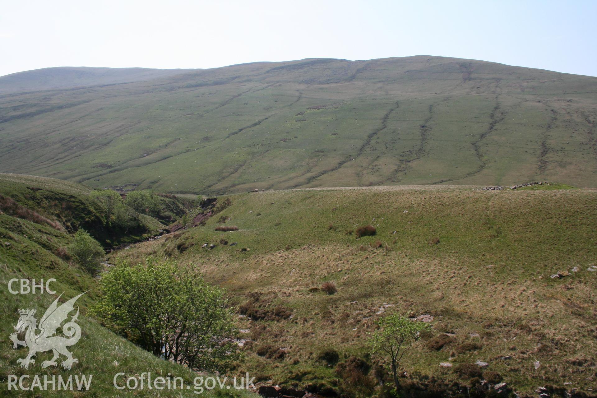 View from the north-east showing landscape setting of cairn, on right of picture.